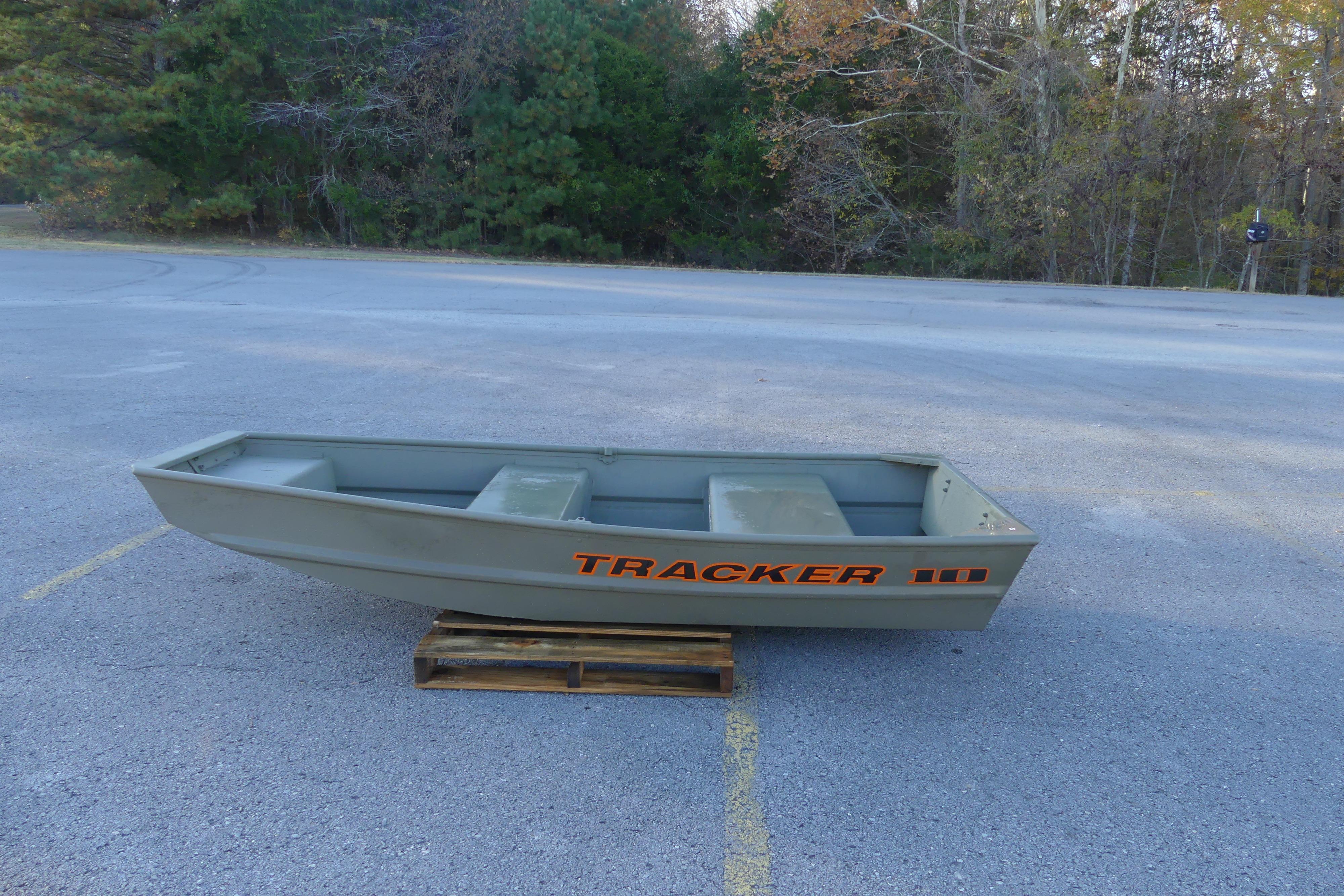 2024 Tracker Grizzly 1036 Jon boat on wooden pallet in parking lot.