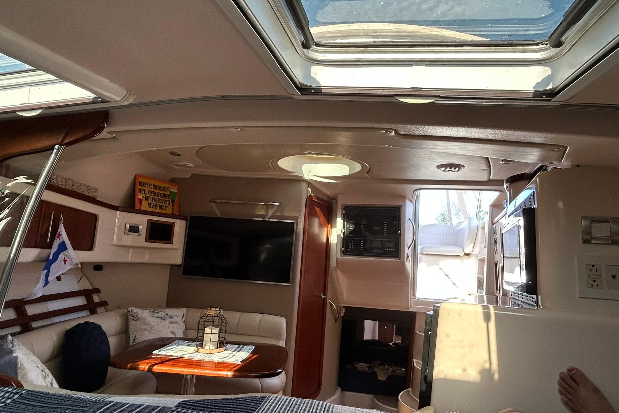 Interior of 2007 Grady-White Express 360 boat with skylight and cozy seating area.