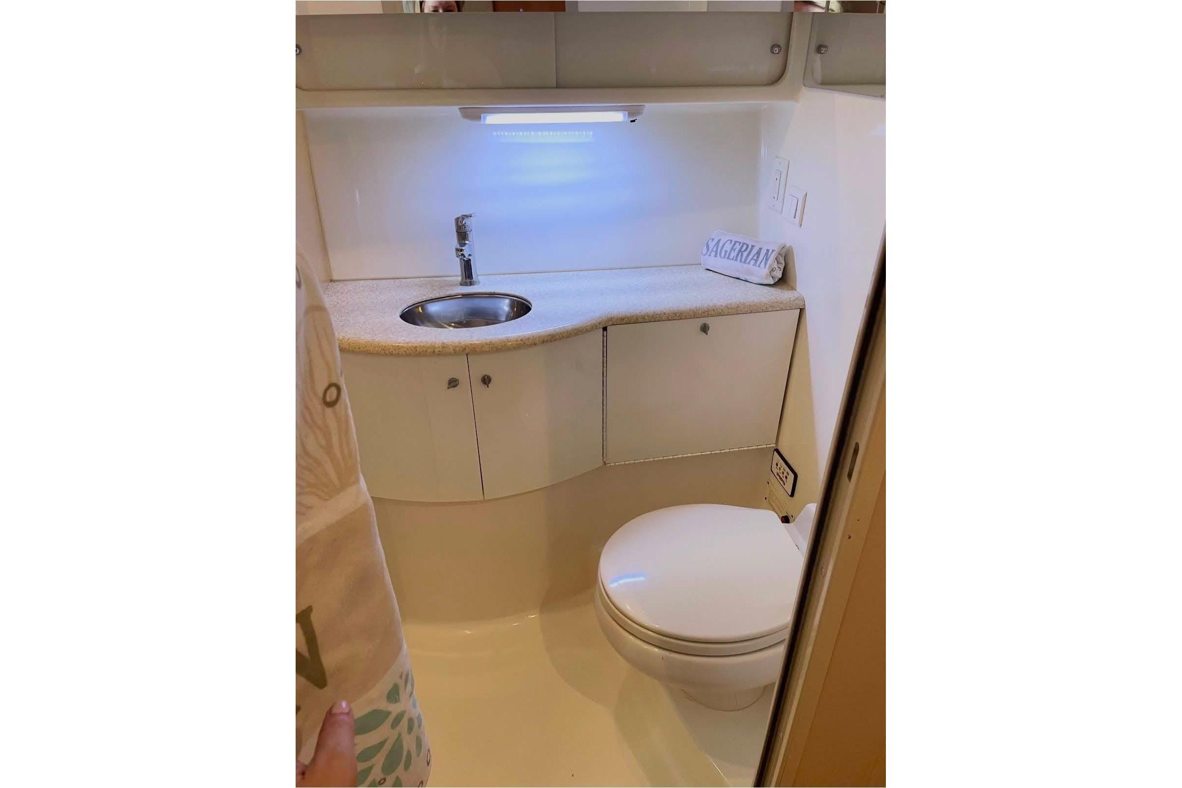 2003 Formula 40 Performance Cruiser bathroom with sink and toilet.
