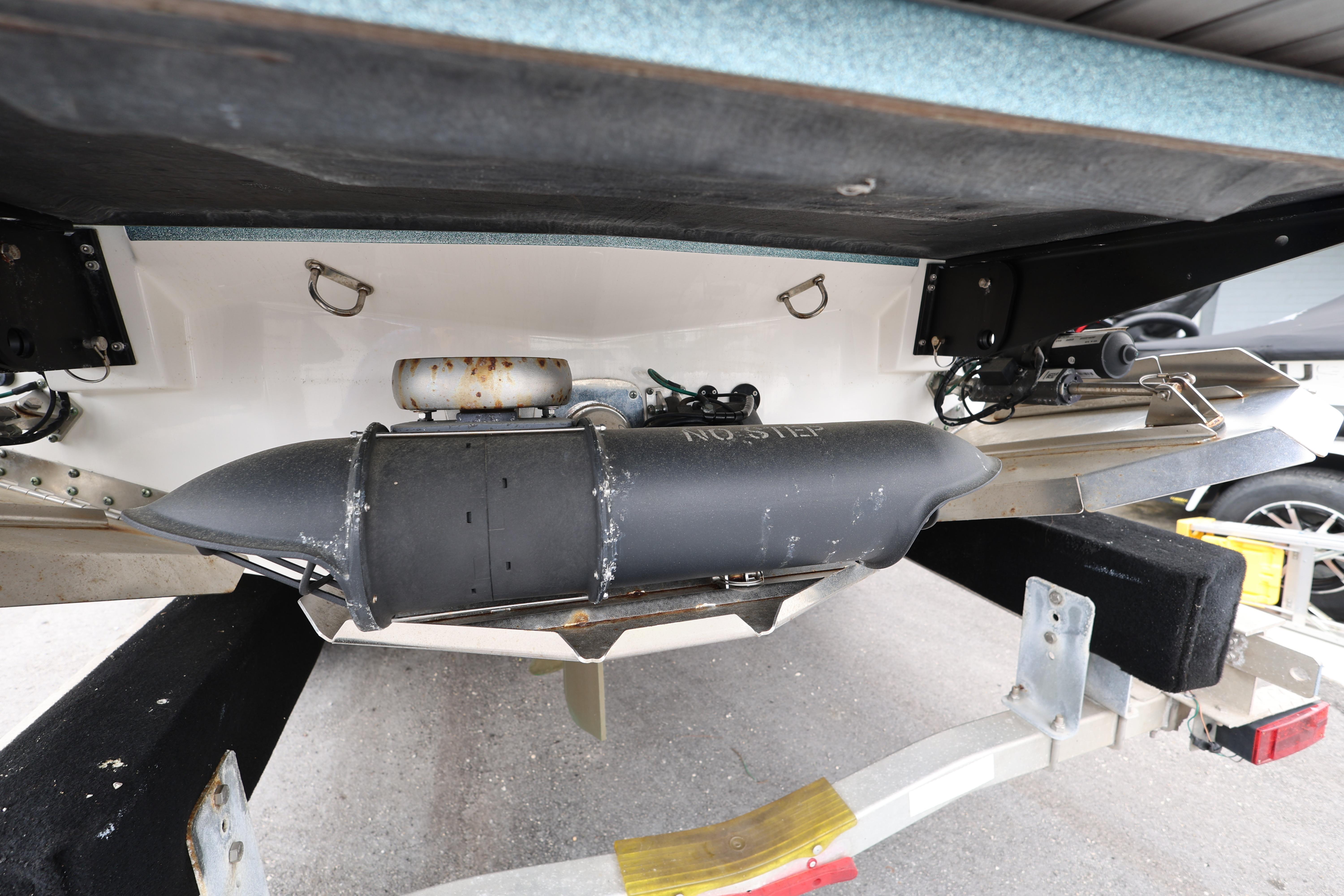2023 MasterCraft X24 boat underside showing propeller and rudder components.