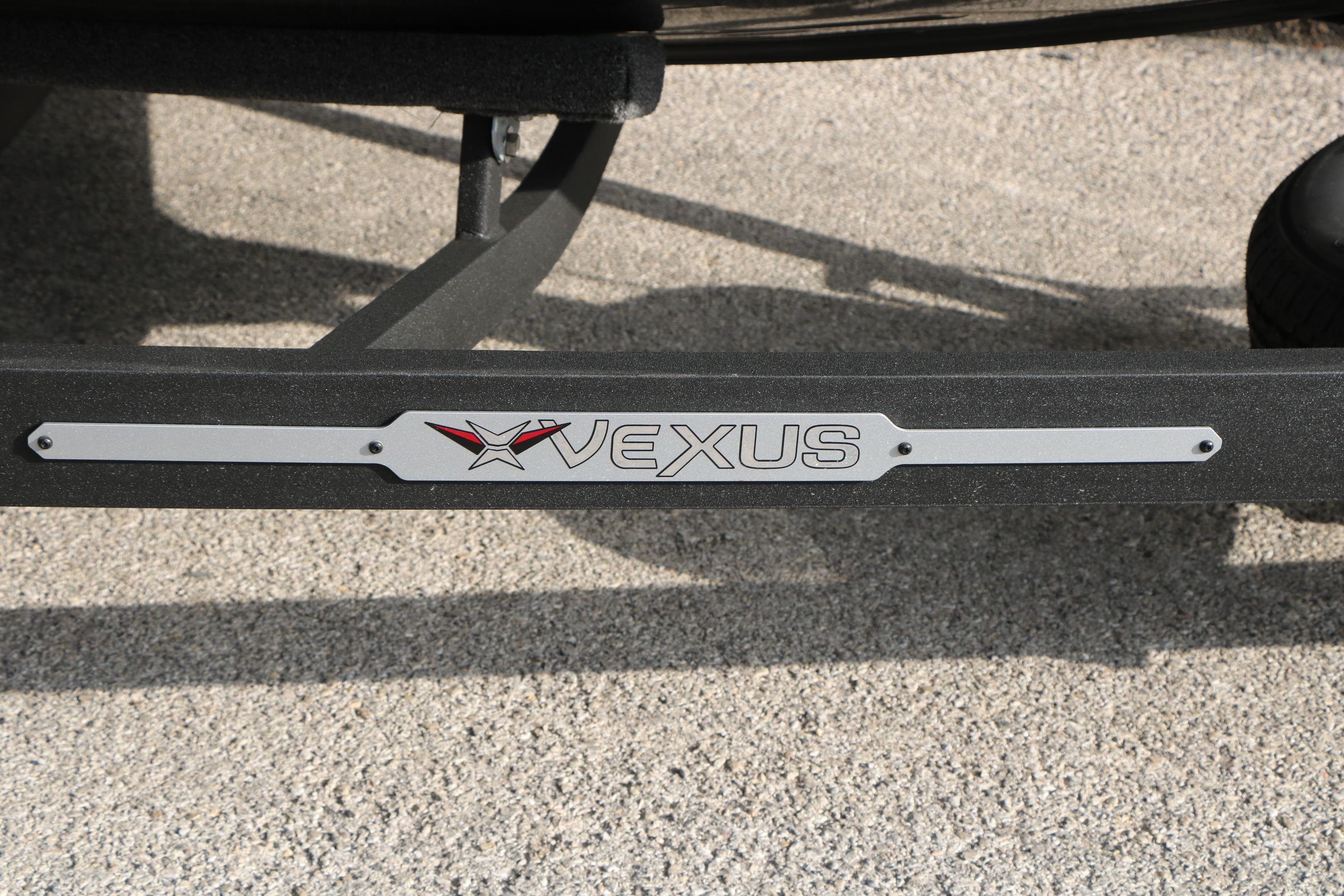 Vexus ADX 190 2026 logo on a boat trailer, displayed on a textured surface.