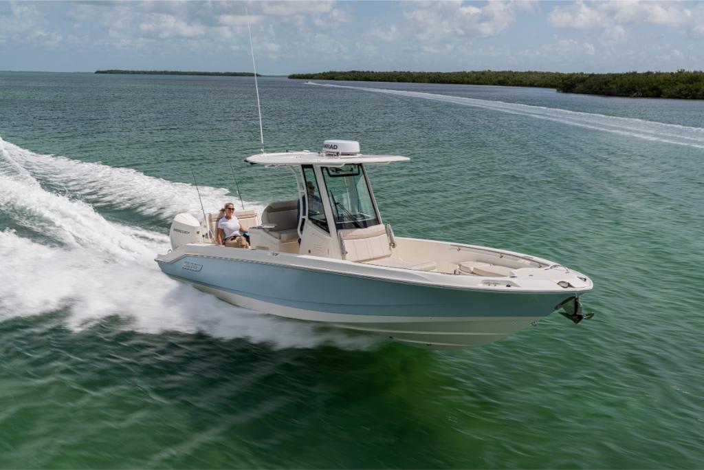 2024 Boston Whaler 280 Dauntless cruising on clear waters.