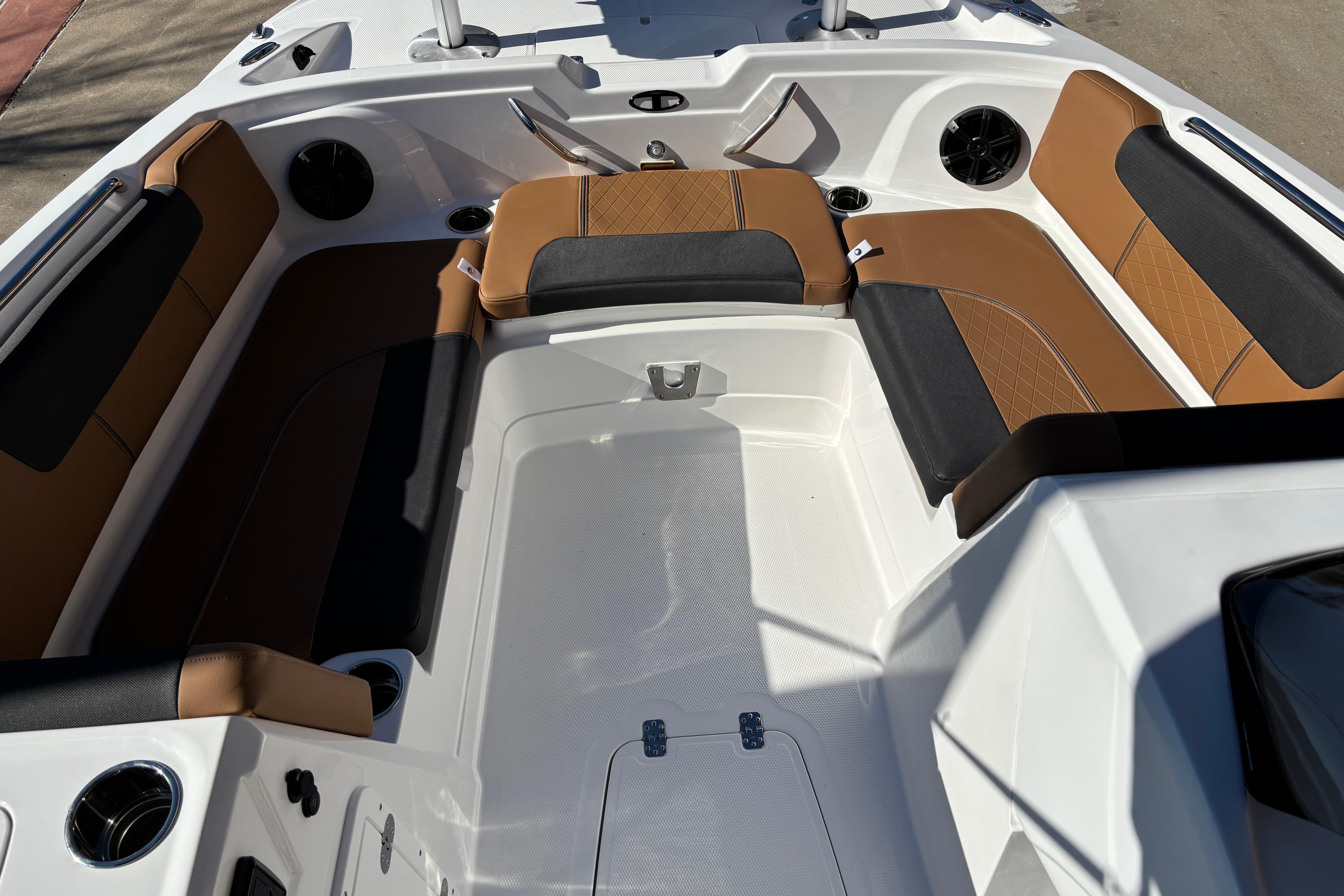 2026 Tahoe 1950 boat interior with brown and black seating, modern design.