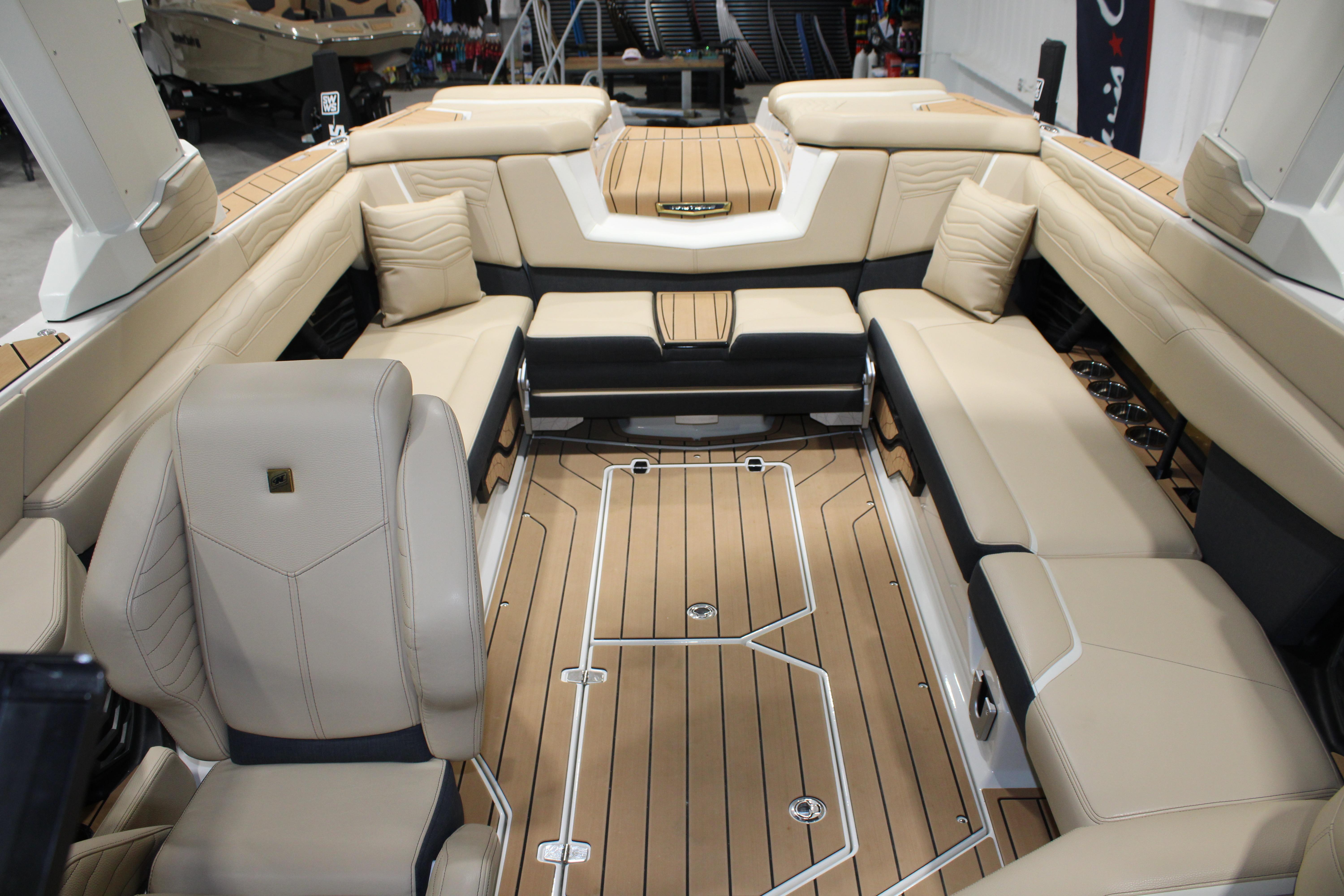 Luxurious interior of 2025 Nautique Super Air Nautique G25 boat with beige seating.
