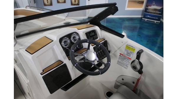 2025 Starcraft SVX 190 OB DC boat dashboard with steering wheel and controls.