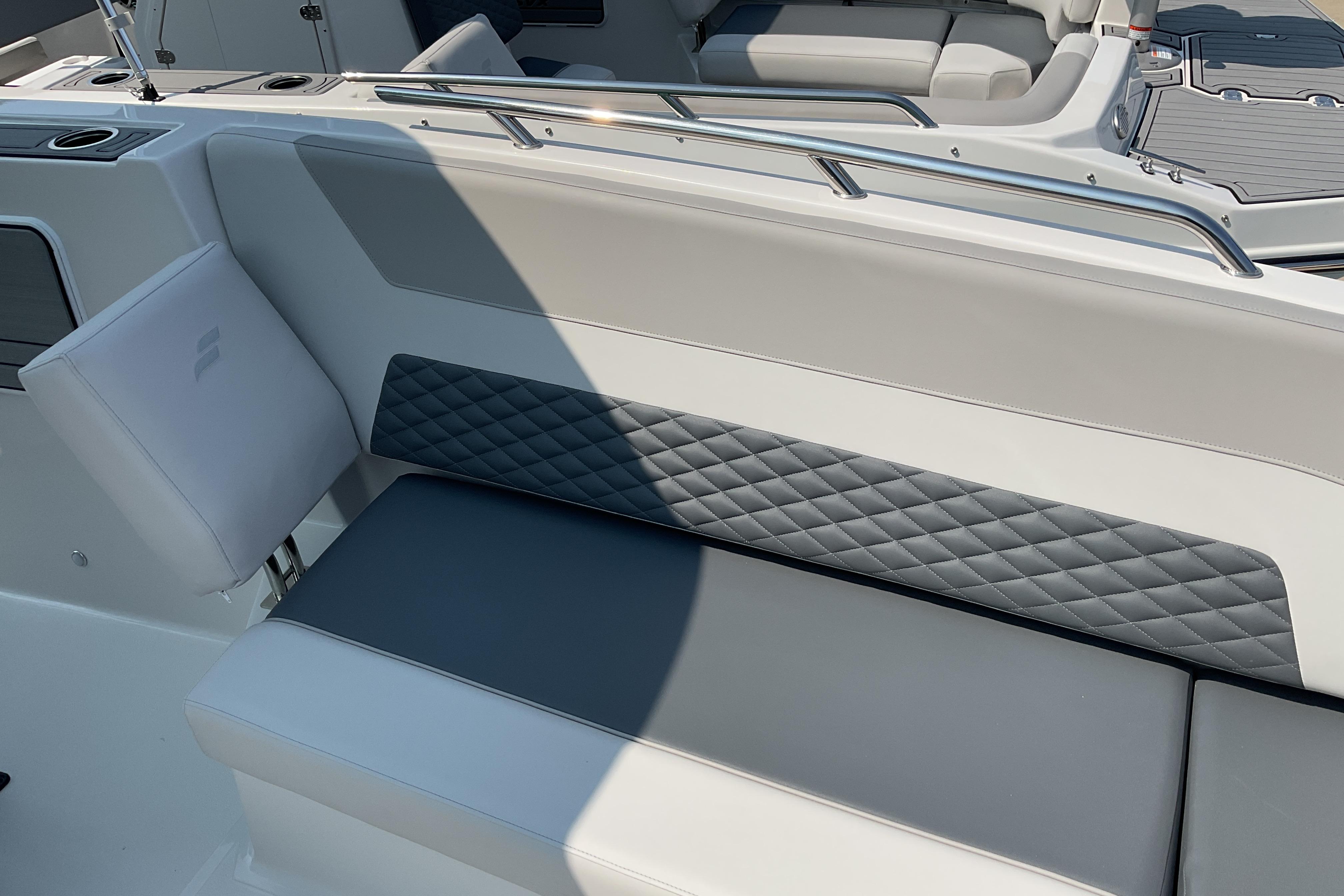 2026 Starcraft SVX 231 OB CC boat interior with cushioned seating and sleek design.