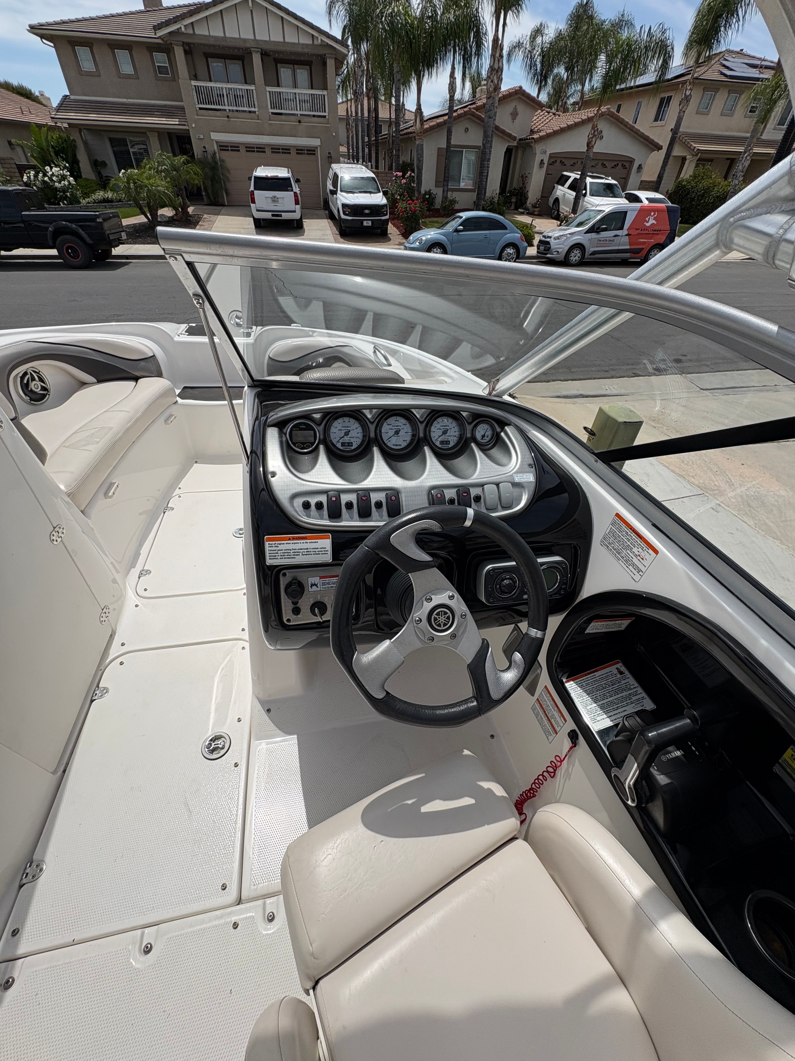 Interior view of a 2009 Yamaha Boats 212X with steering console.