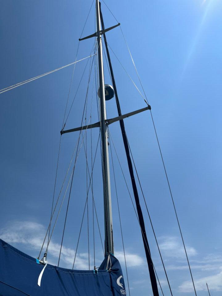 Sailboat mast of 1986 Nautor Swan 43 against a clear blue sky.