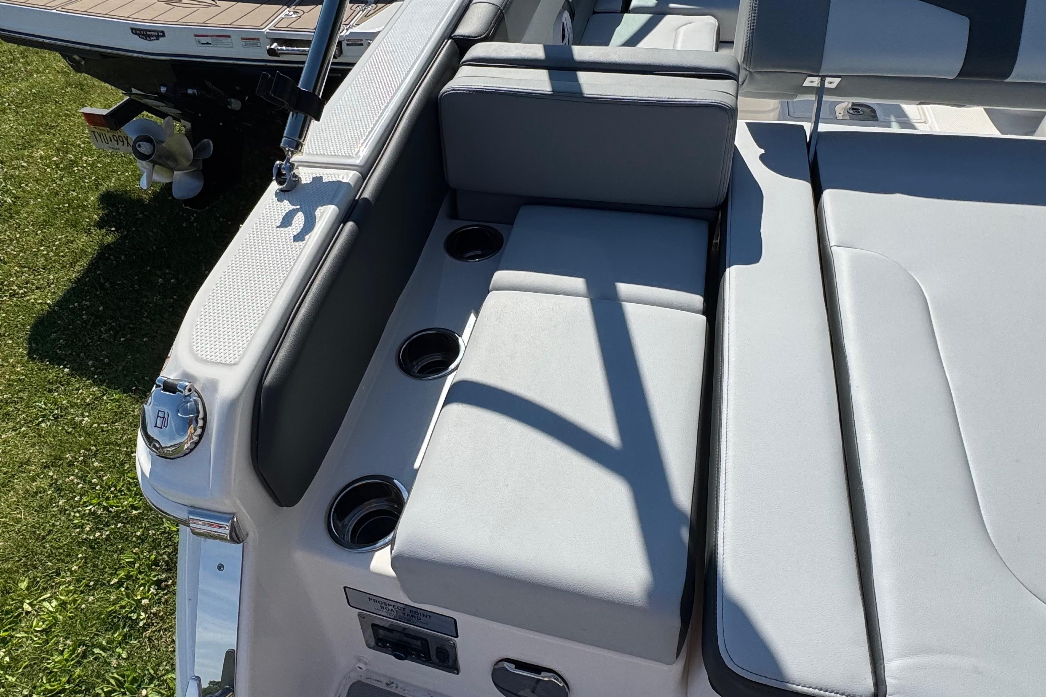 2026 Chaparral SSX 4 boat interior with cushioned seating and cup holders.
