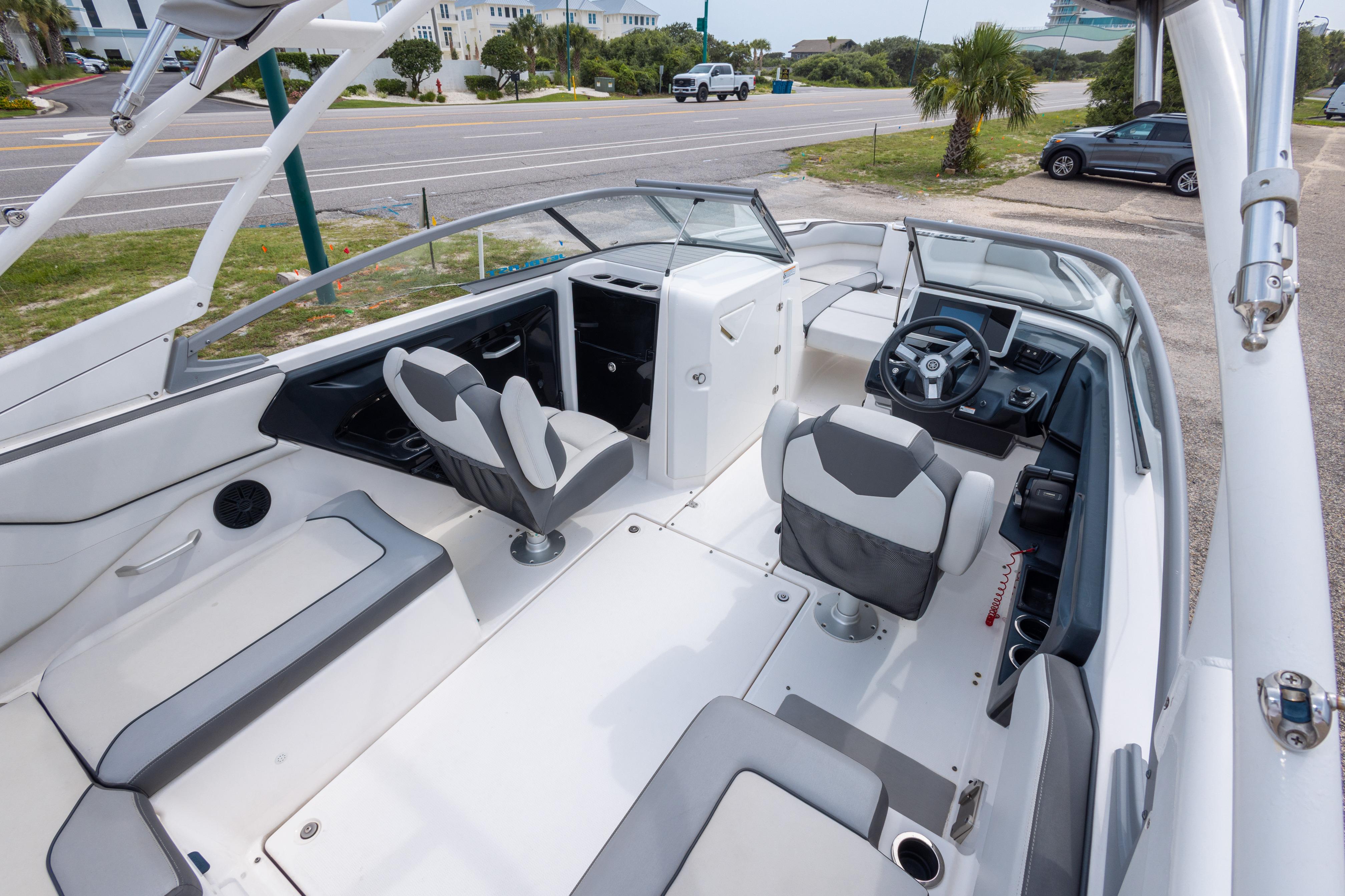 2021 Yamaha Boats AR250 interior with sleek seating and modern dashboard design.