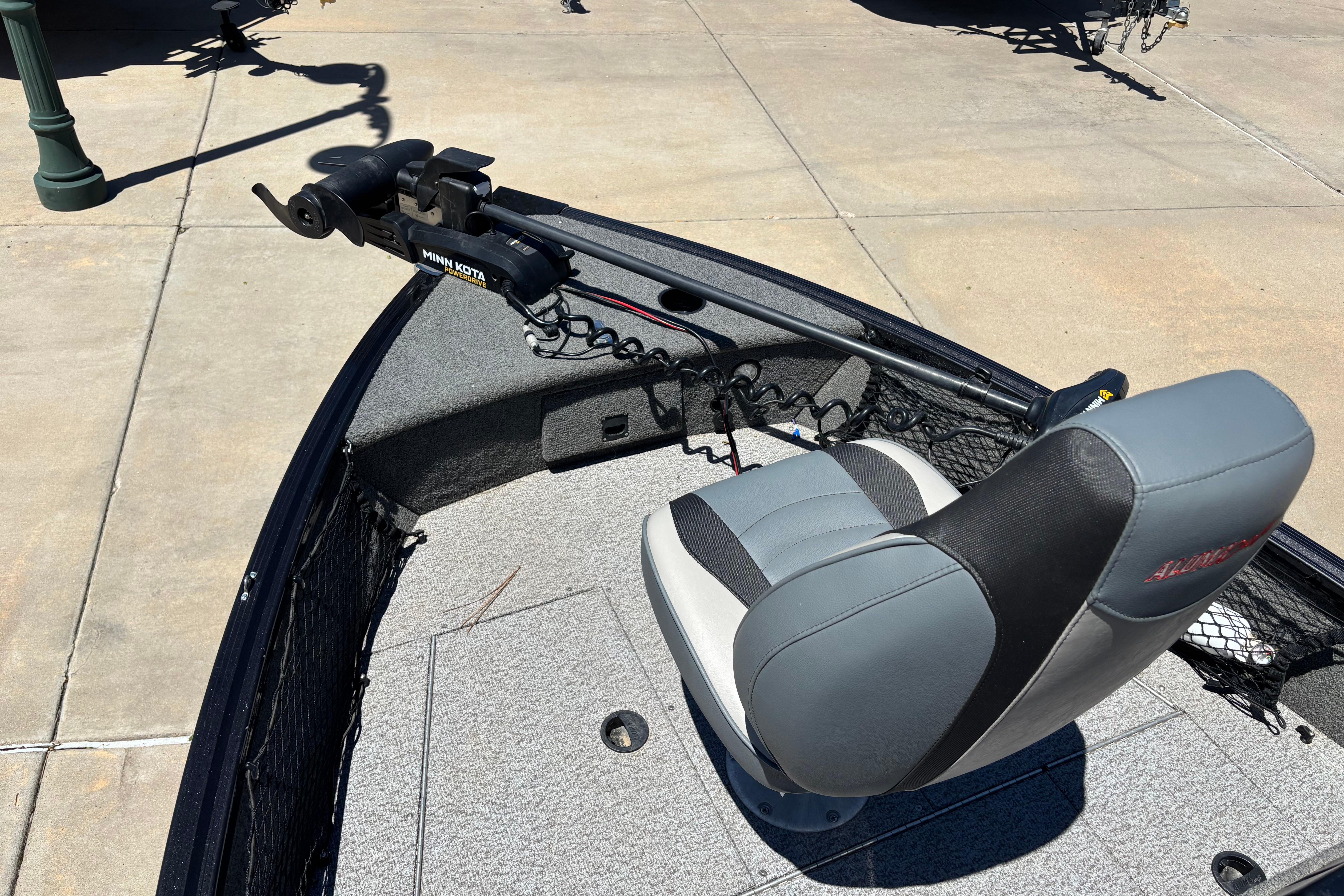 2021 Alumacraft Classic 165 boat with Minn Kota trolling motor and cushioned seat.