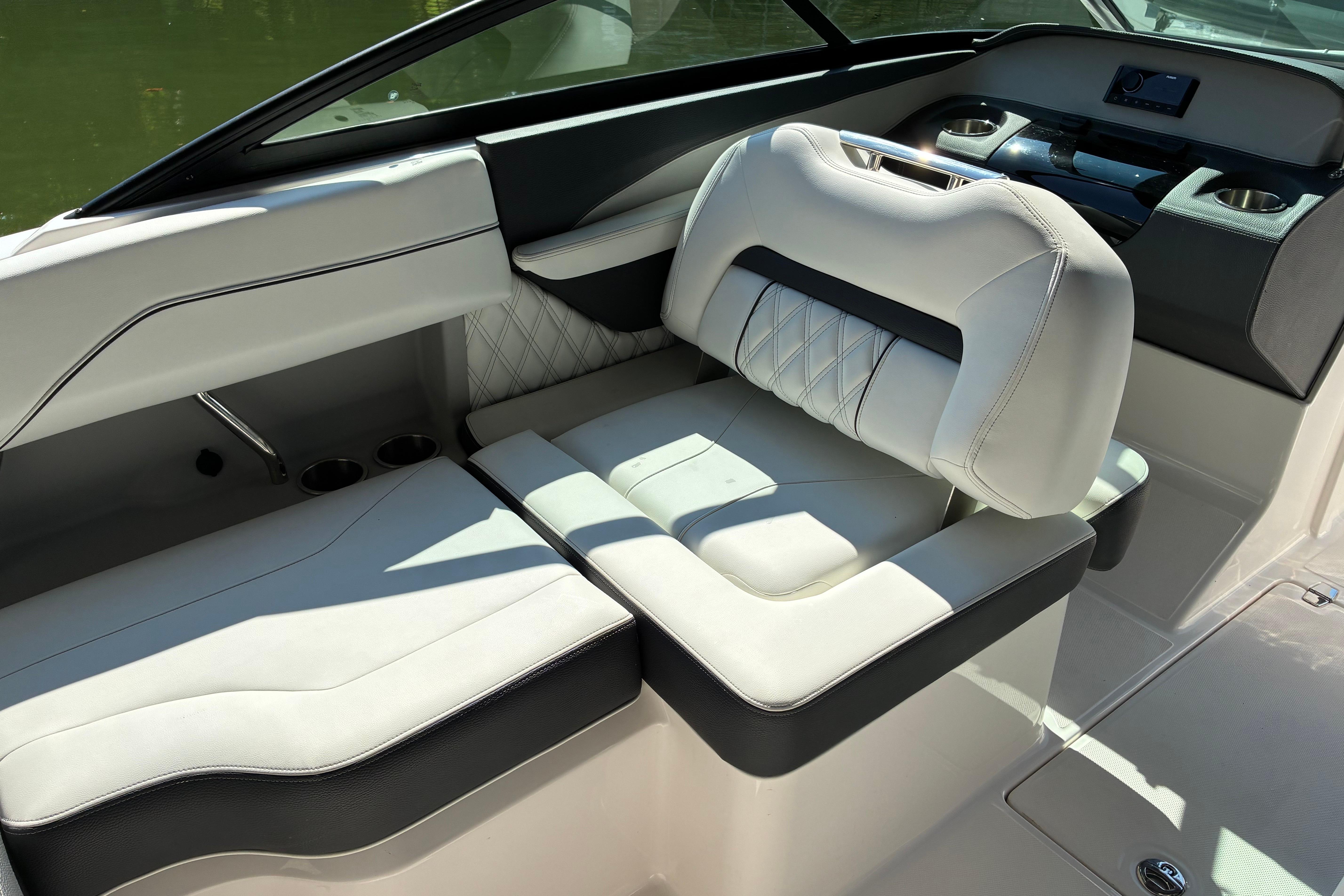 2025 Regal LS2 boat interior with luxurious white seating and modern dashboard design.