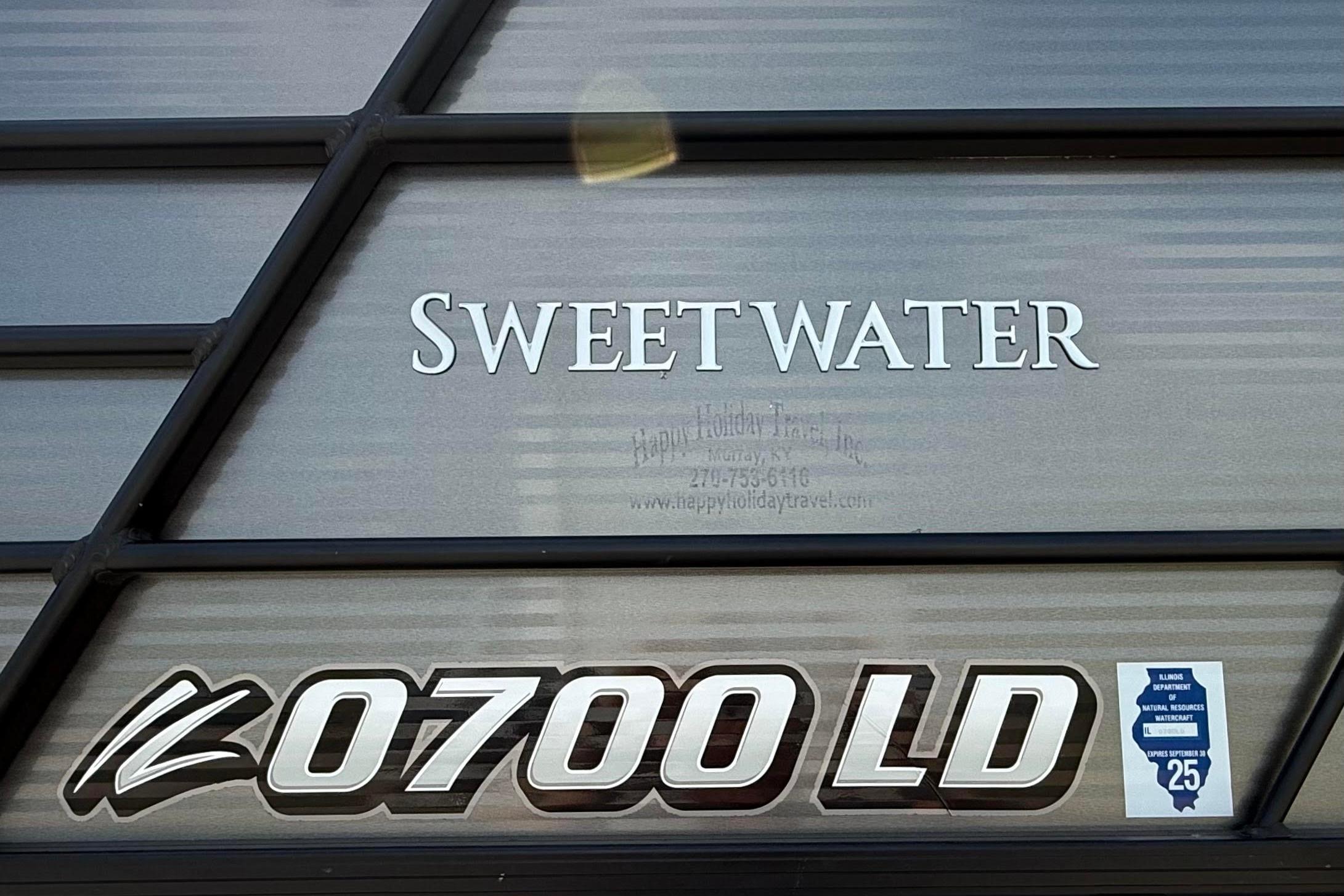 2022 Godfrey SWEETWATER 2486 boat with registration number 0700 LD displayed.