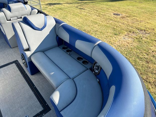 Interior of 2023 Montara 25' SURF BOSS 2.0 with blue and gray seating.