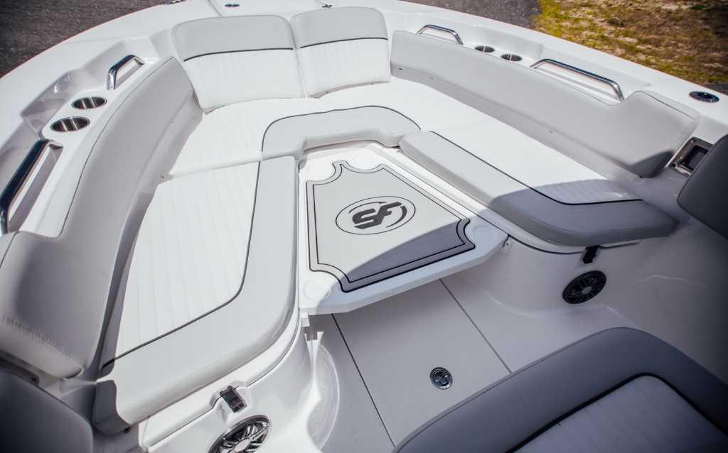 2021 Sea Fox 248 Commander boat interior with white seating and cup holders.