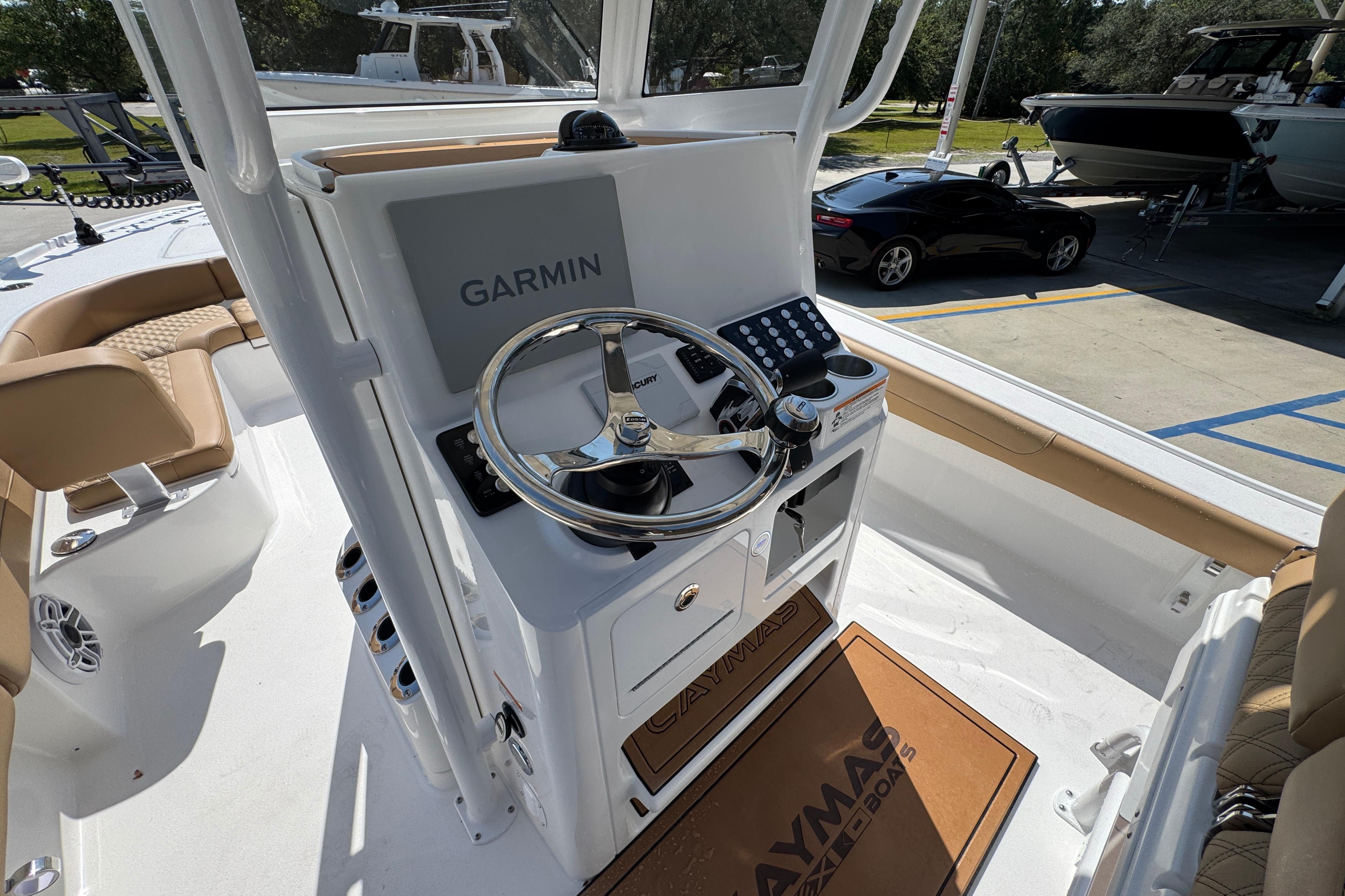 2027 Caymas 26 HB boat helm with Garmin navigation system and Mercury steering wheel.