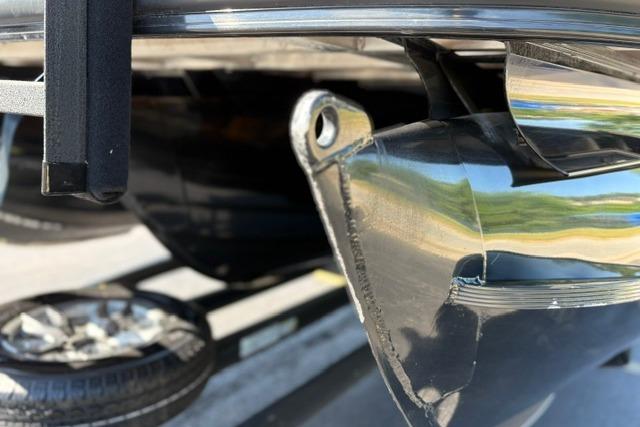 Close-up of a 2025 Regency 250 DL3 boat component, showcasing metallic details.
