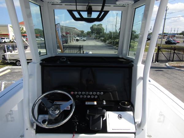 2024 Wellcraft 263 Fisherman boat helm with steering wheel and control panel.