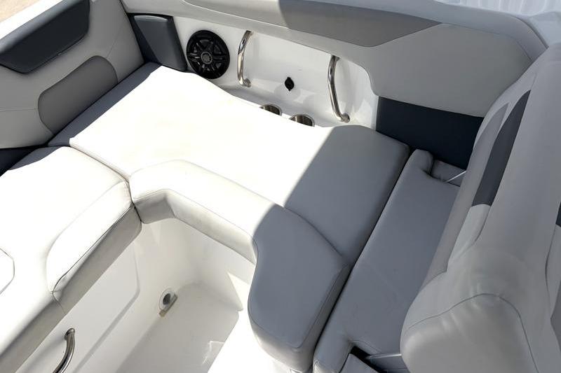 Interior seating of 2026 Hurricane SunDeck Sport 2050 OB boat, featuring gray upholstery.