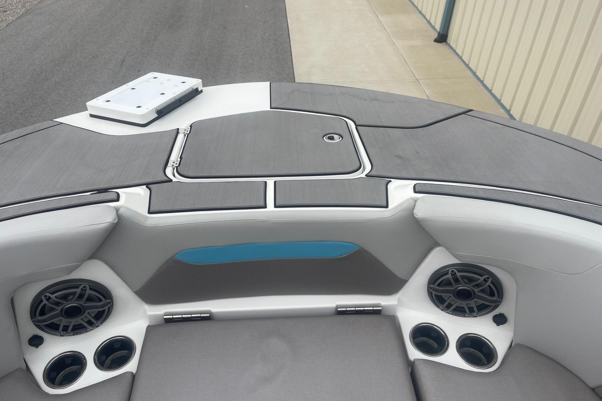 2025 Hurricane Center Console 24 OB boat interior with speakers and storage compartments.