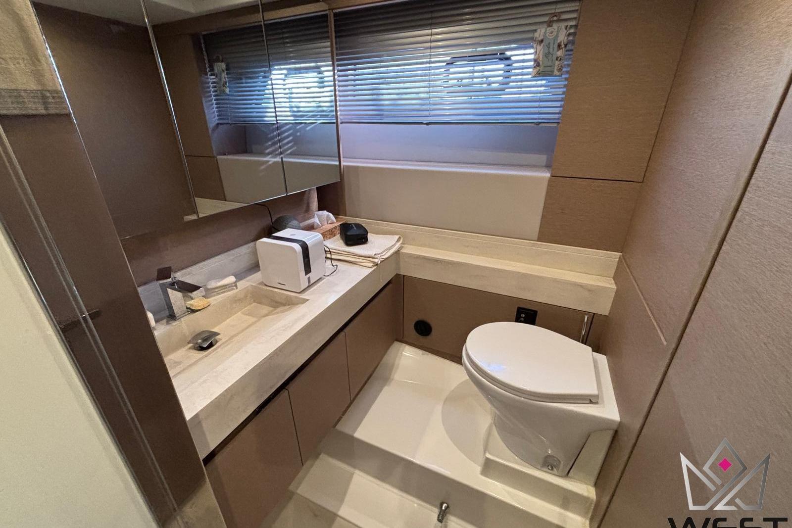 Luxurious bathroom in 2018 Prestige 520 yacht with modern fixtures and sleek design.