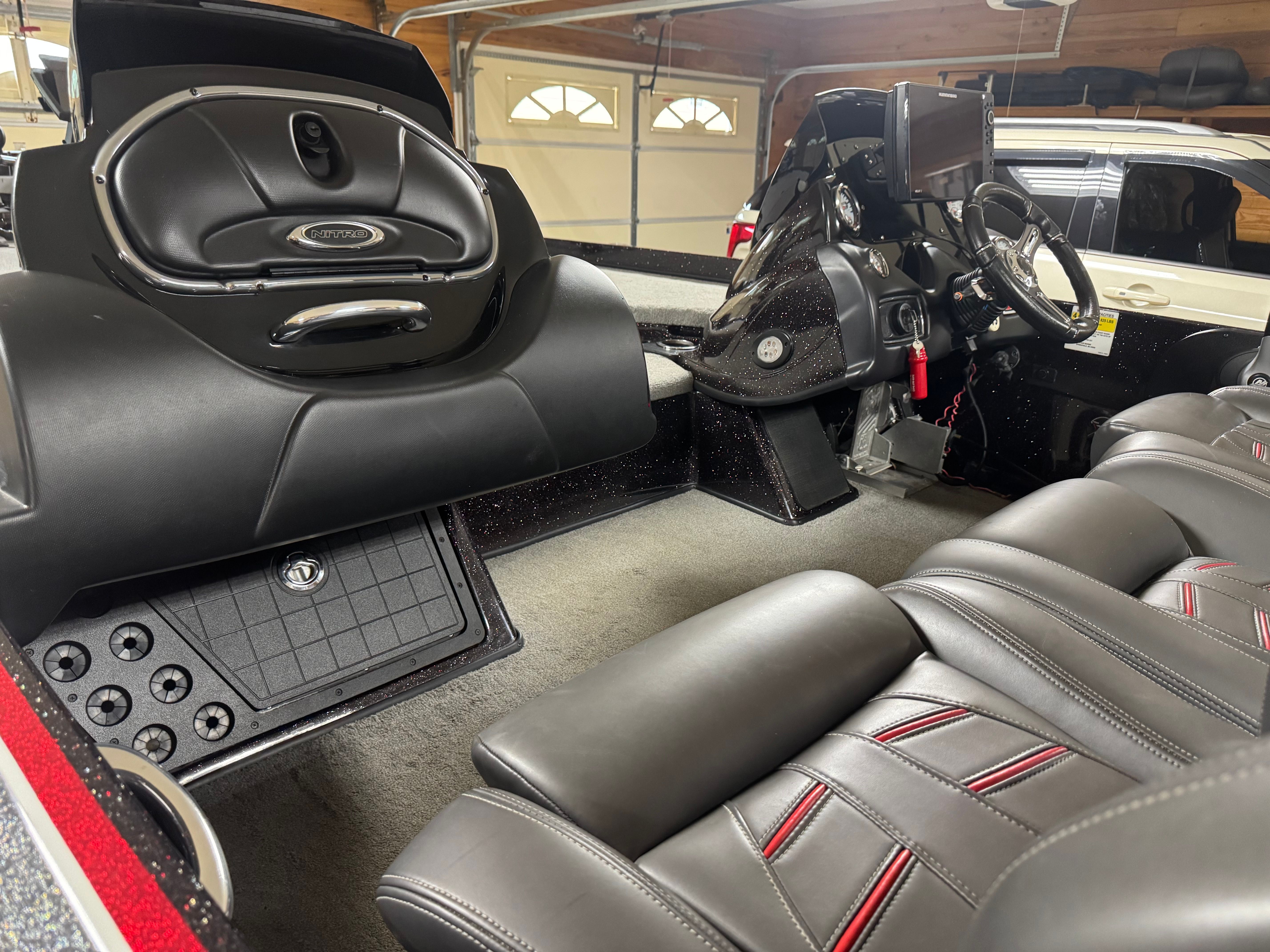 Interior view of a Nitro Z21 boat with leather seats and control console.