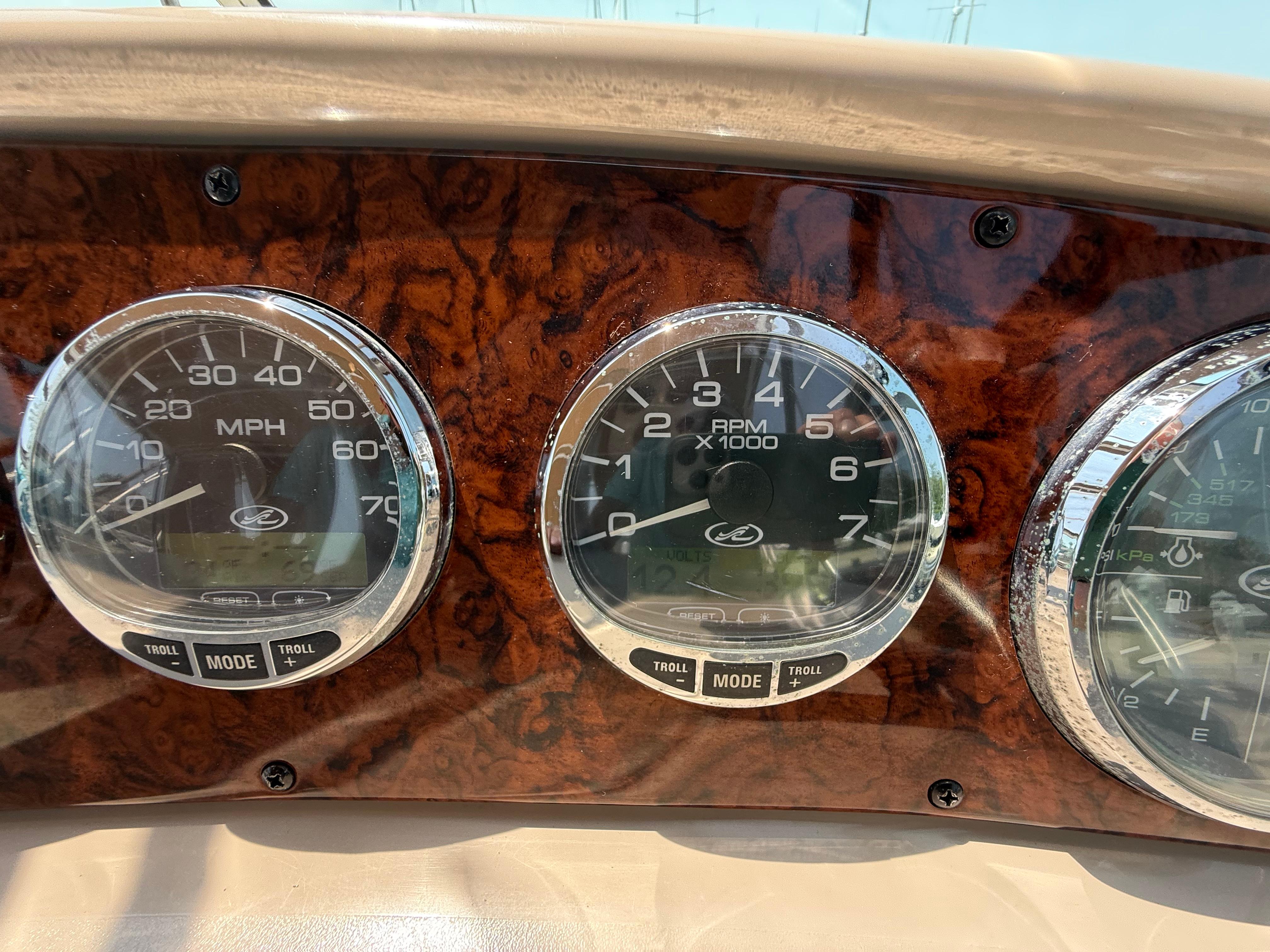 Dashboard gauges of a 2004 Sea Ray 290 Amberjack boat, showing speed and RPM.
