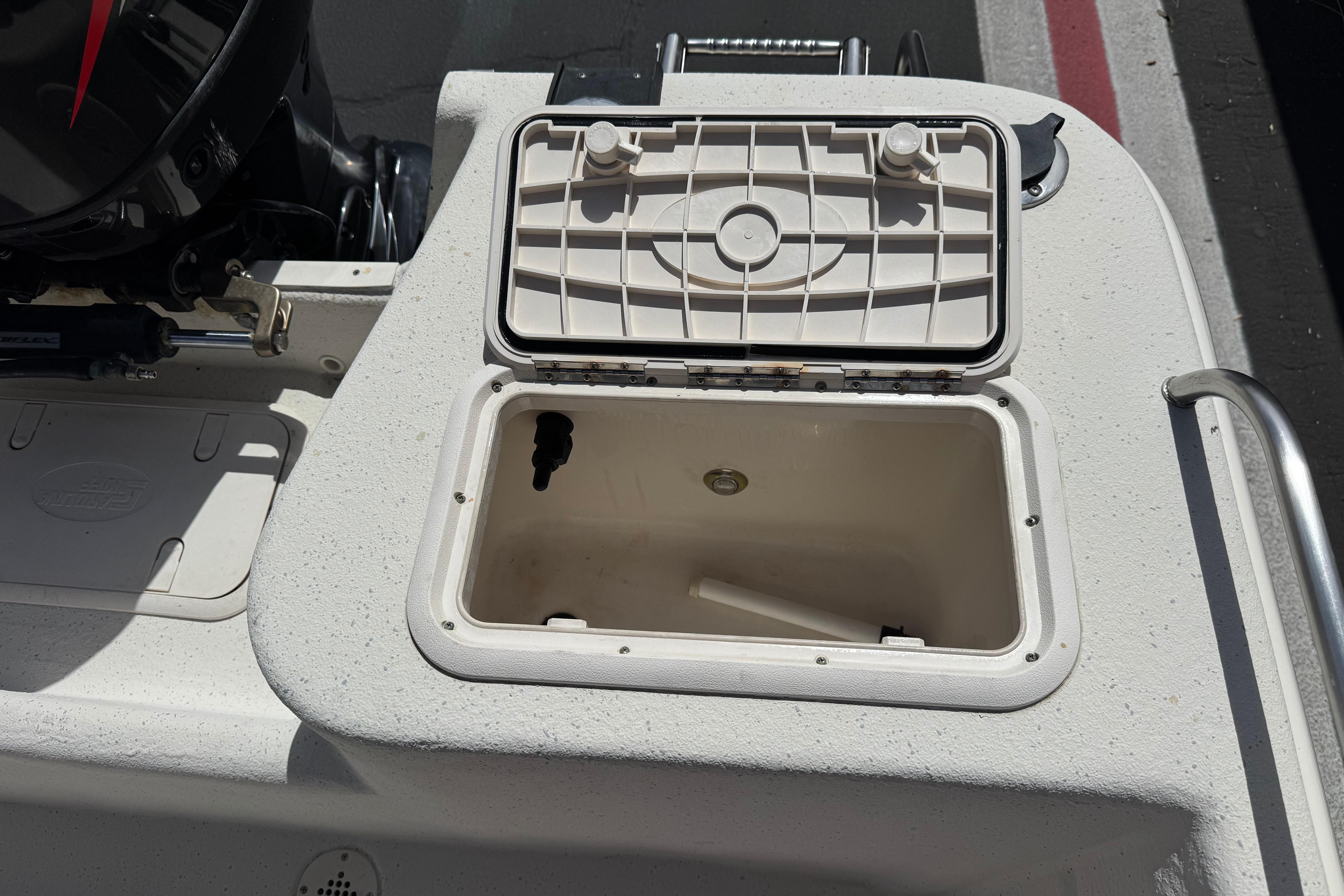 Open storage compartment on 2013 Carolina Skiff Sea Chaser 1950 RG boat.
