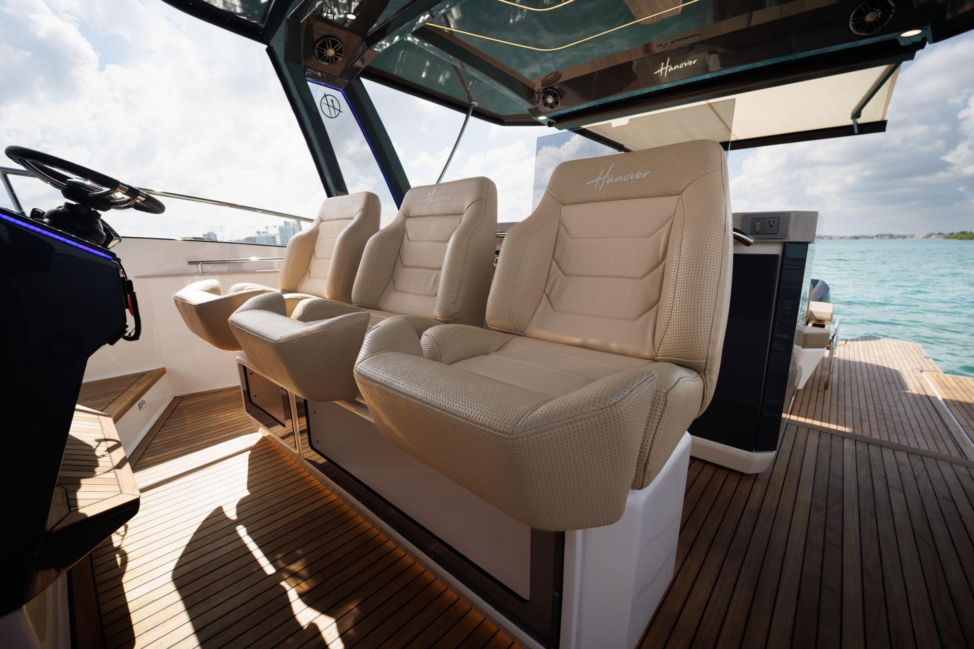 Luxurious seating on 2026 Hanover 447 yacht with scenic ocean view.