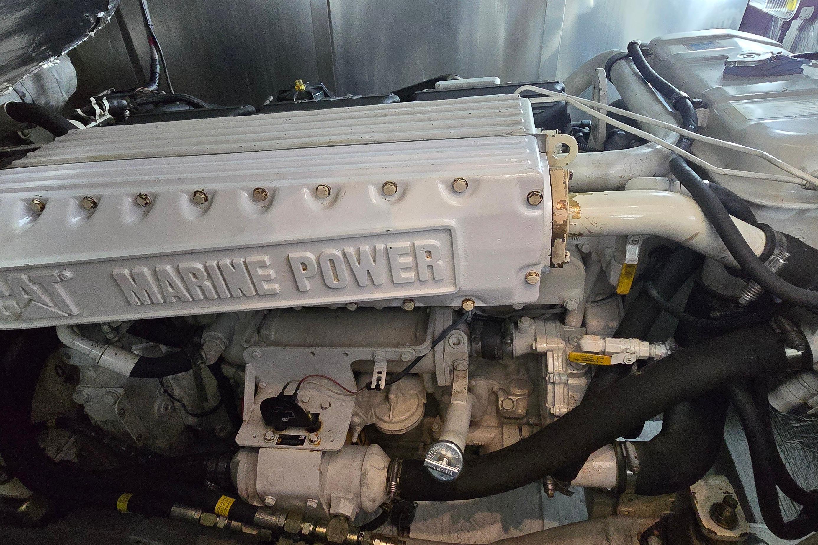 Engine compartment of a 2004 Sunseeker Camargue 50 yacht, featuring a CAT Marine Power engine.