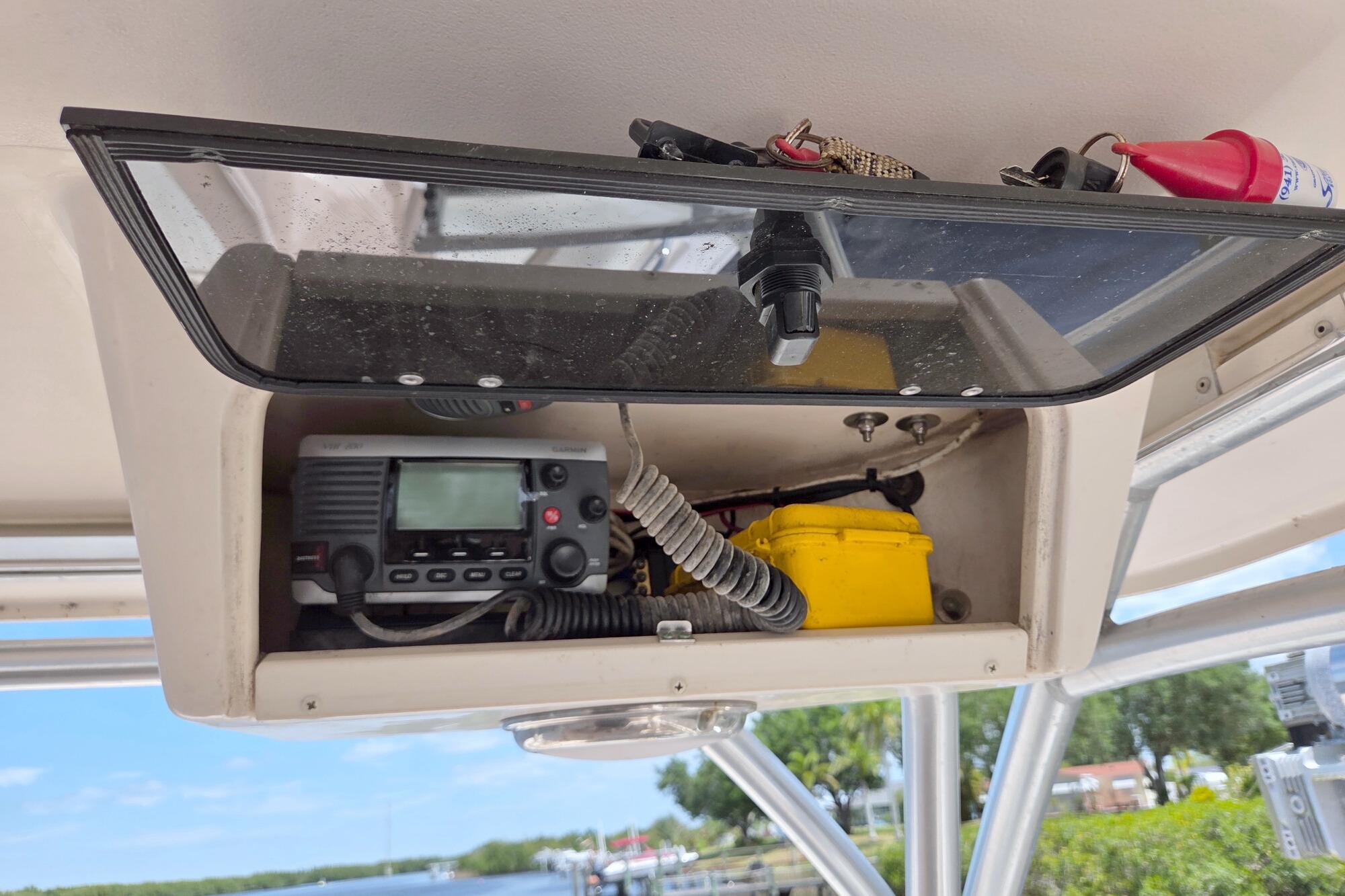 2013 Grady-White Freedom 275 boat console with radio and safety equipment.