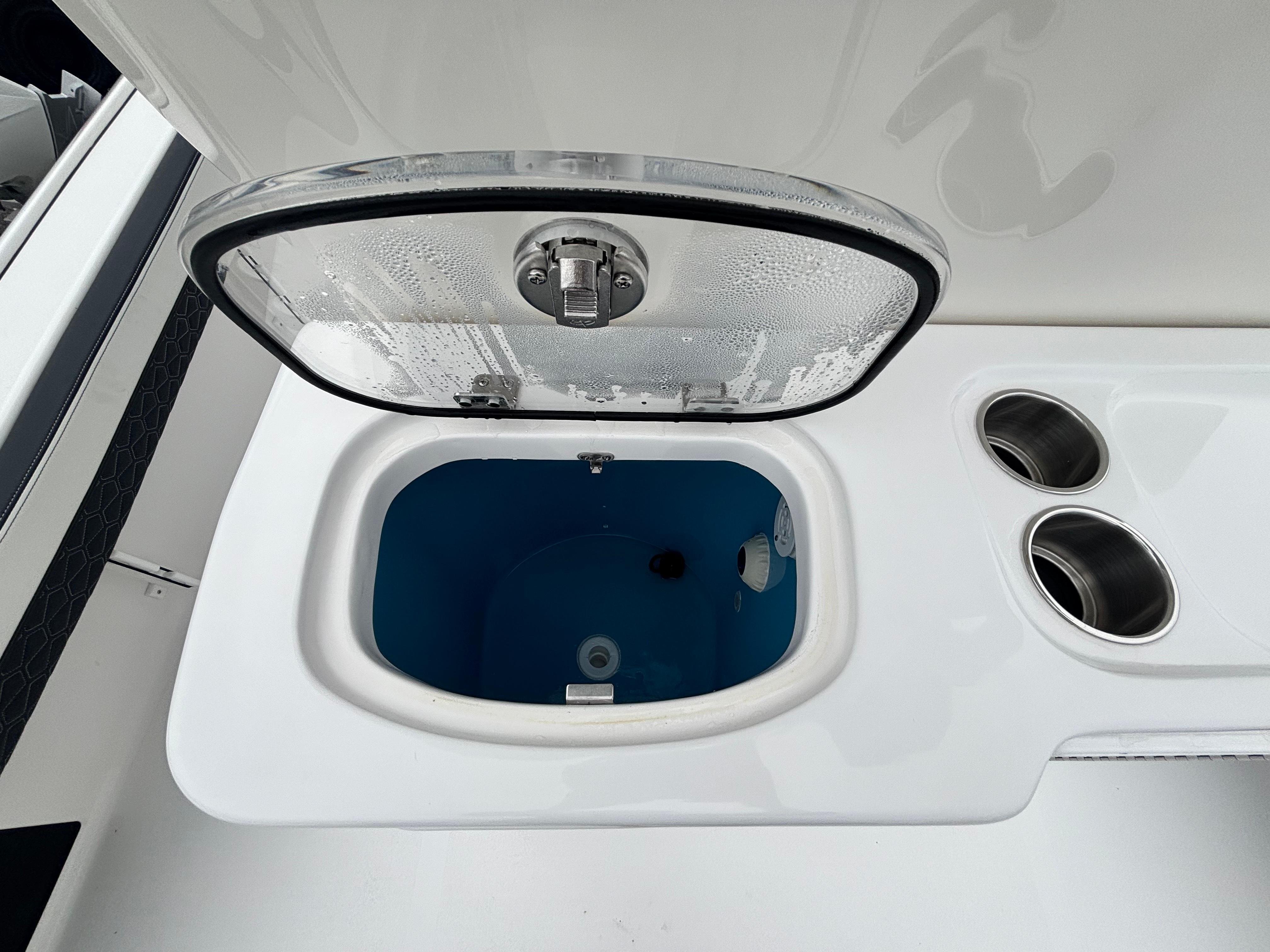 Livewell on 2026 Tidewater 2700 Carolina Bay boat with cup holders.