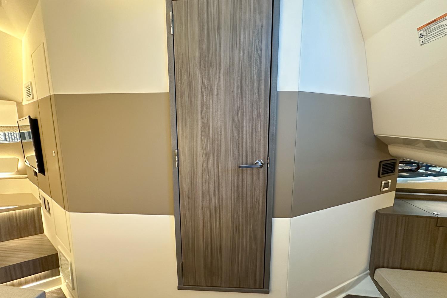 Interior of 2025 Sea Ray Sundancer 370, featuring modern wood paneling and sleek design elements.