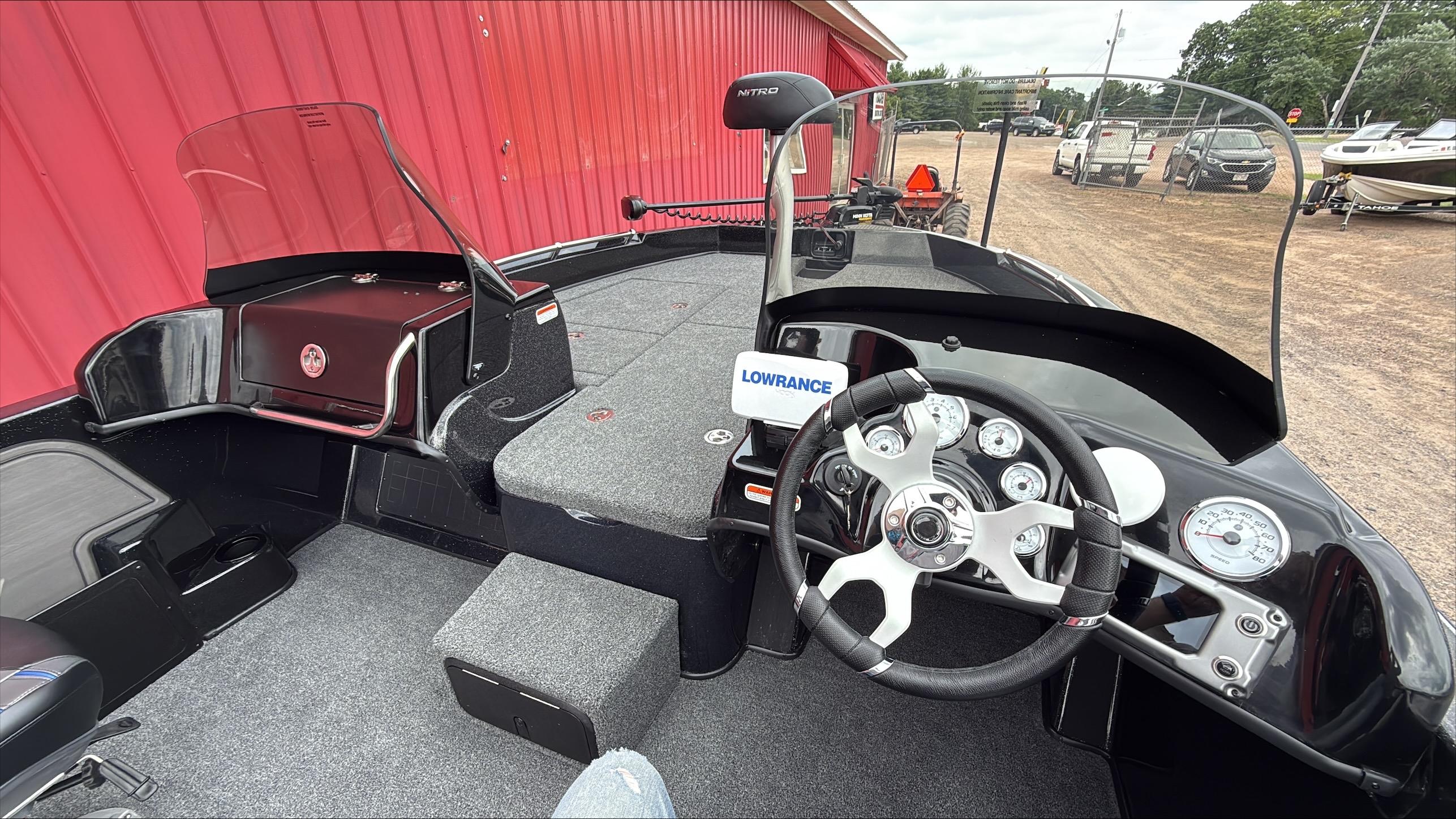 Interior of 2025 Nitro ZV19 boat with steering wheel and dashboard controls.