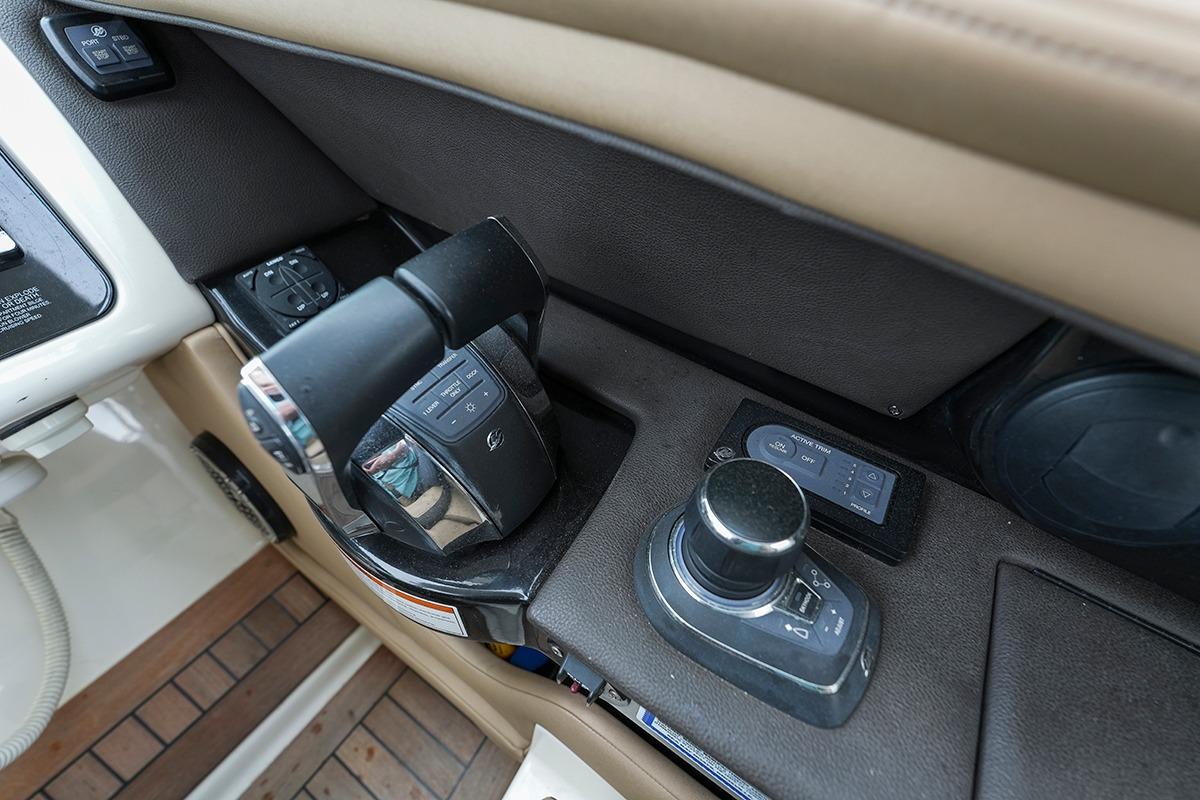 Control panel of a 2018 Sea Ray SLX 350 boat, featuring throttle and joystick controls.