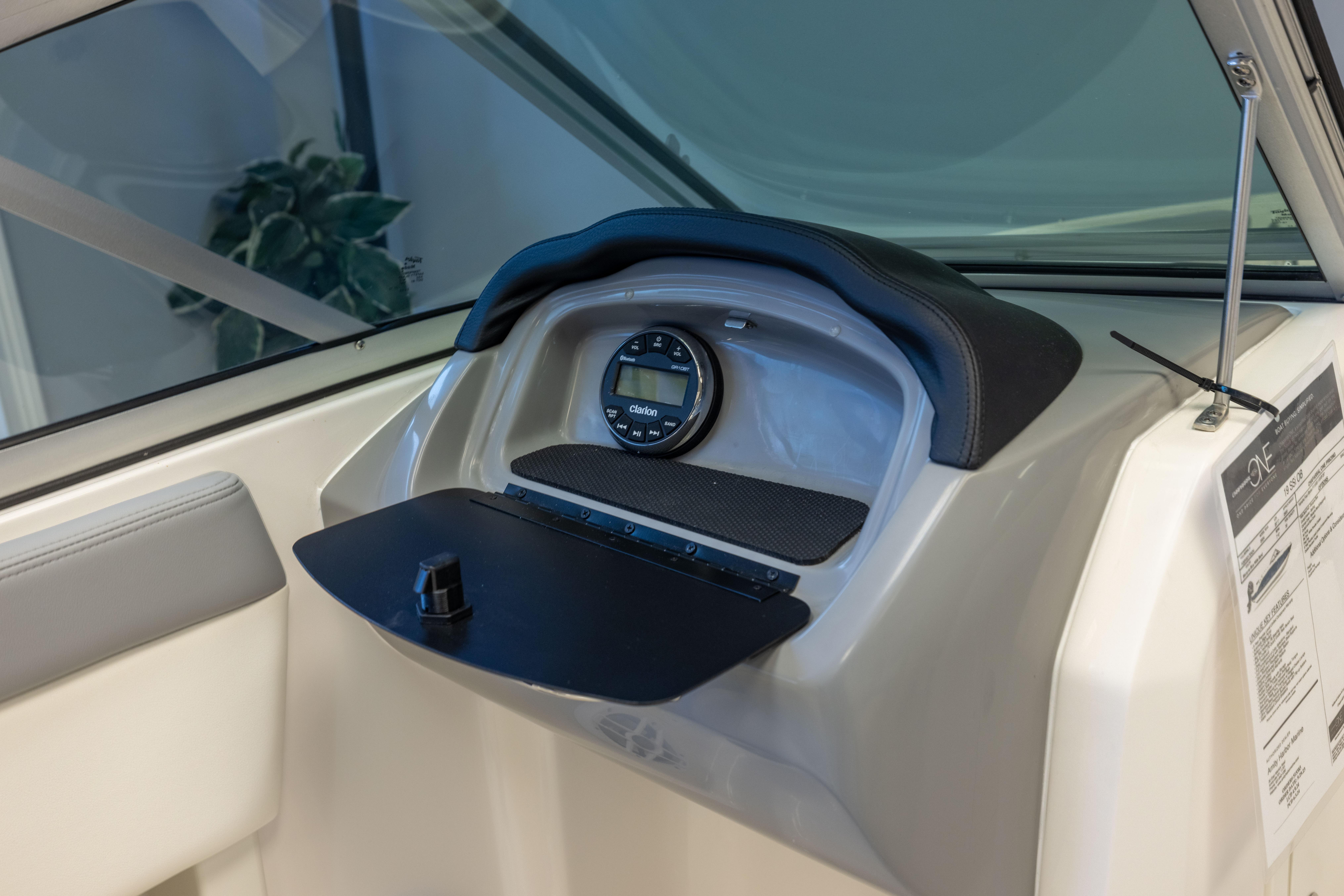 2024 Chaparral 19 SSi OB dashboard with Clarion audio system and sleek design.