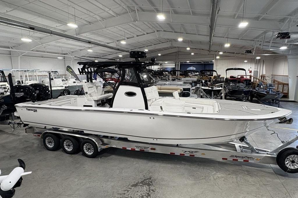 2026 Tidewater 3100 Carolina Bay boat on trailer in showroom.