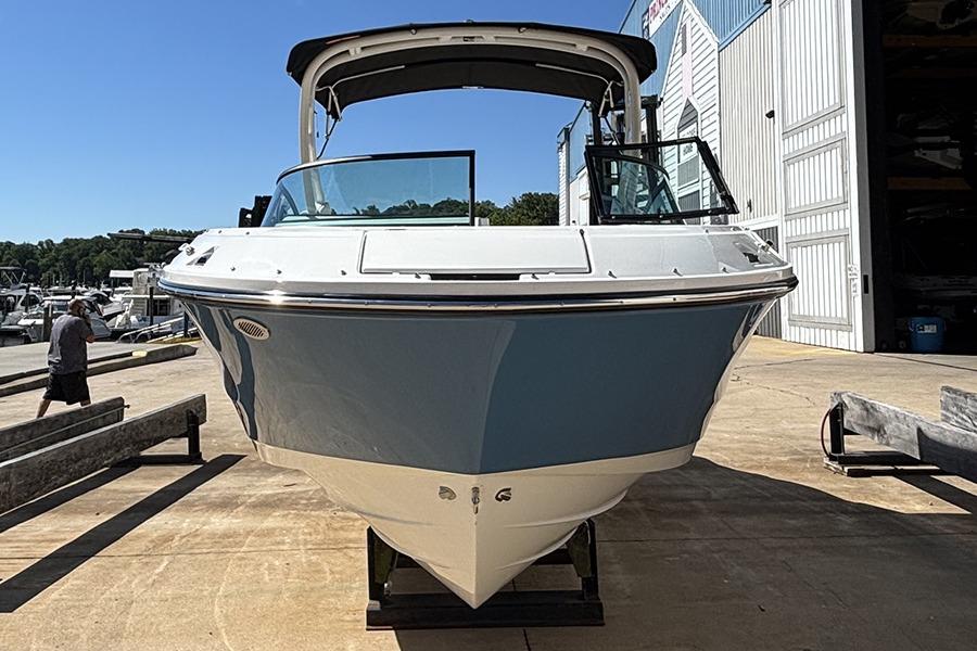 2027 Sea Ray SDX 230 Outboard boat on a dock, front view.
