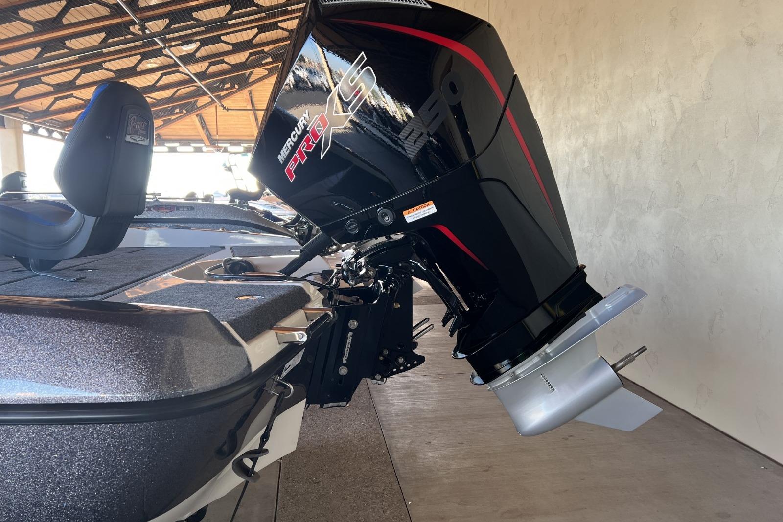 2025 Ranger 212LS boat with Mercury Pro XS outboard motor in a covered area.