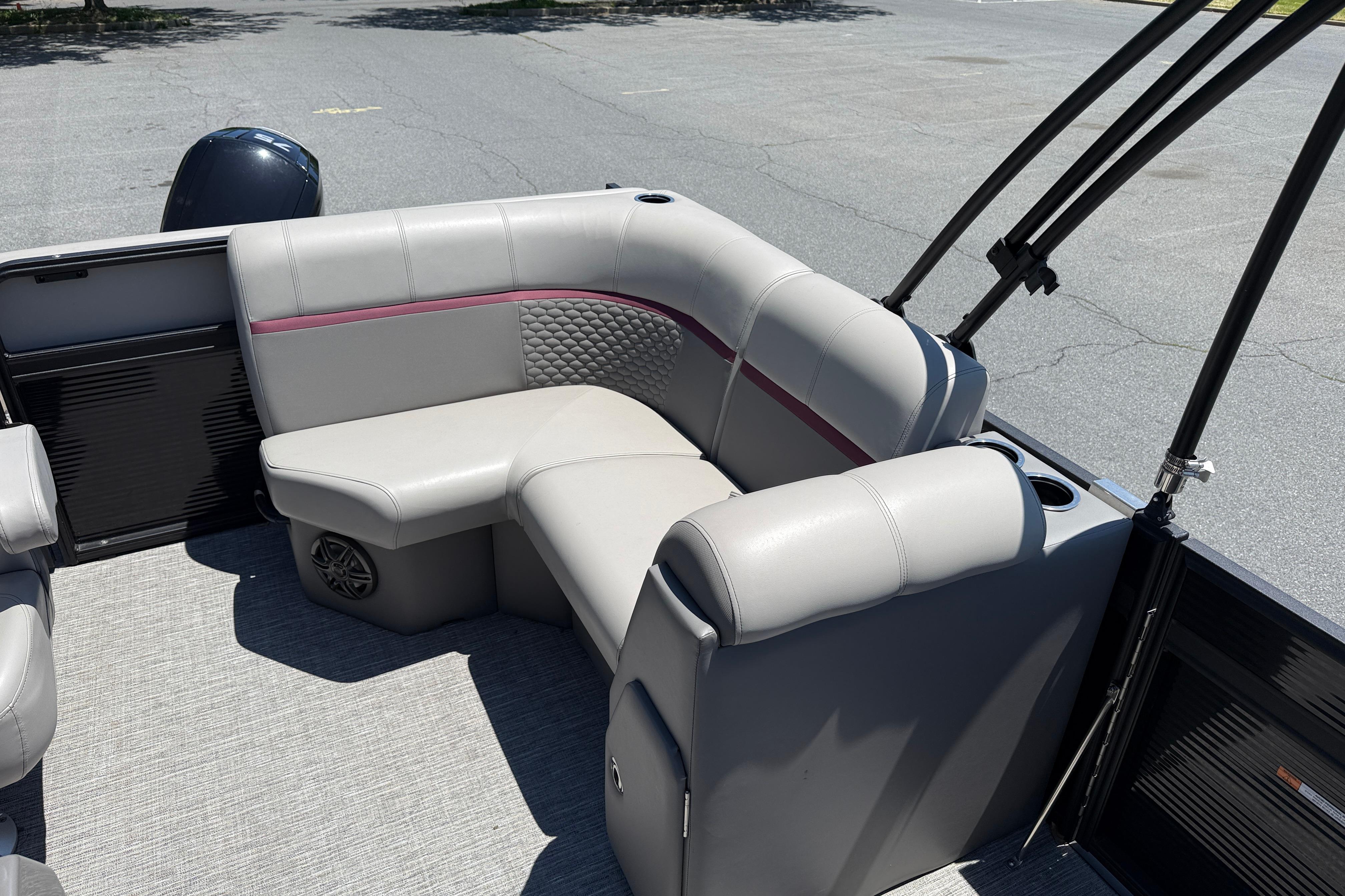 2023 Apex 818 boat interior with gray seating and cup holders.