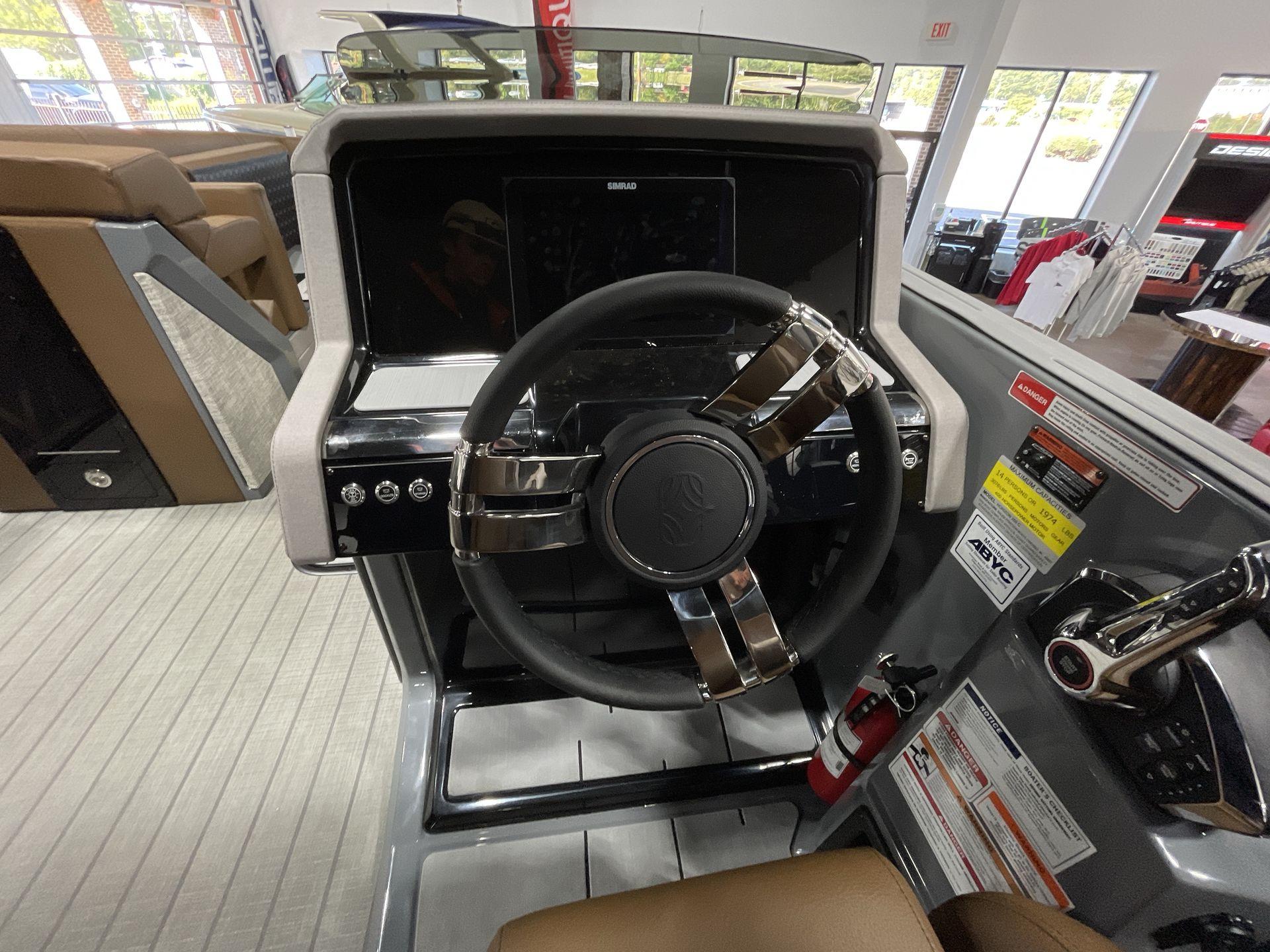 Steering console of 2025 Balise Horizon 26C boat, featuring modern controls and dashboard.
