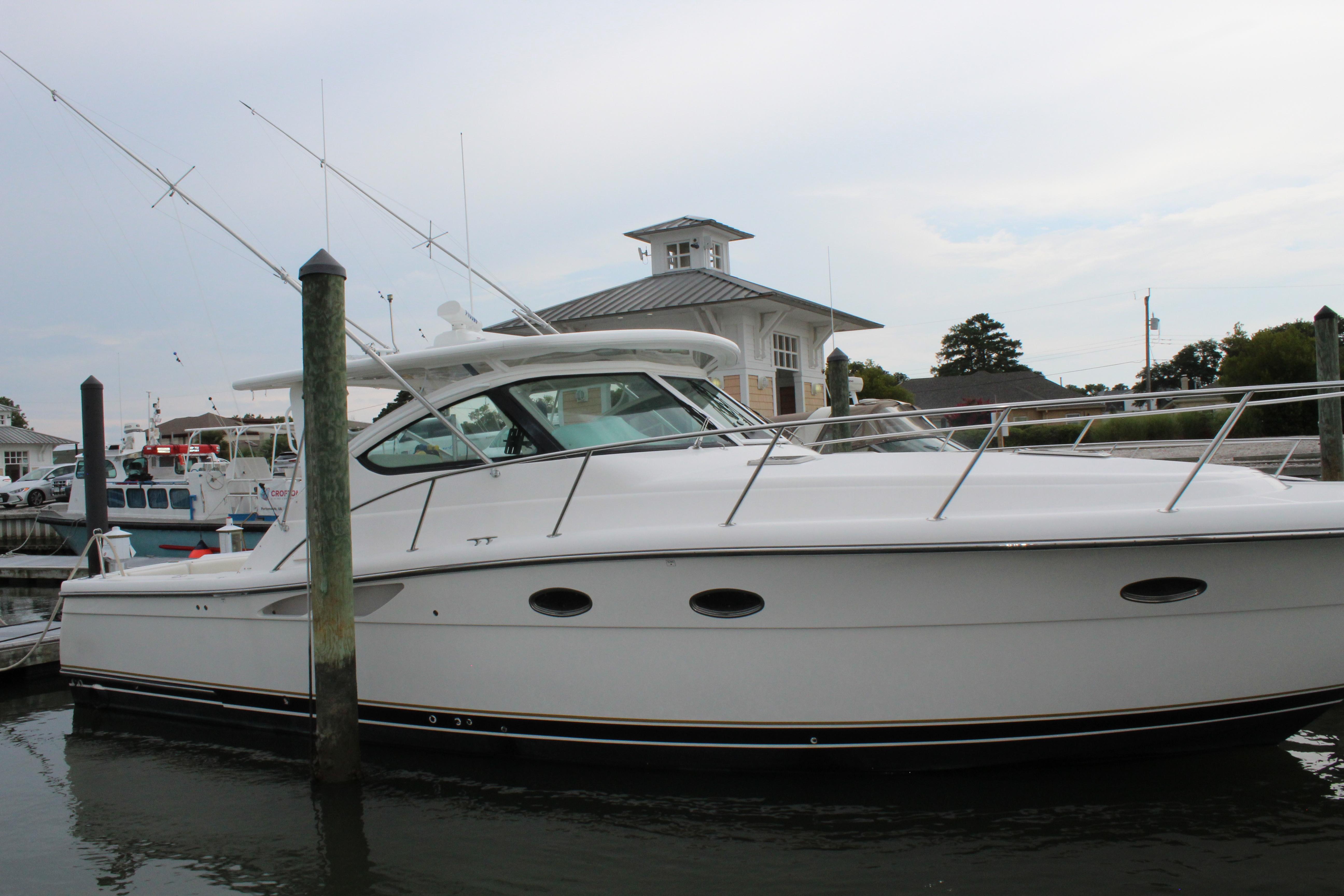 2002 Tiara Yachts 3800 Open docked at a marina.