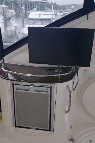 2010 Meridian 441 Sedan interior with TV and mini-fridge.