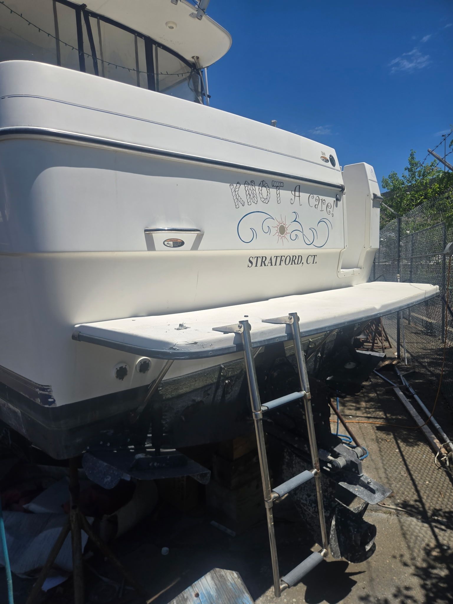 2003 Bayliner 28 boat in Stratford, CT, with ladder.