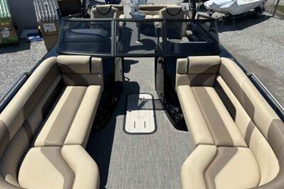 2025 SunCatcher Amara boat interior with beige seating and spacious layout.