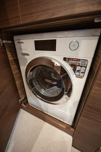 2024 Princess V55 yacht interior with built-in Miele washing machine.