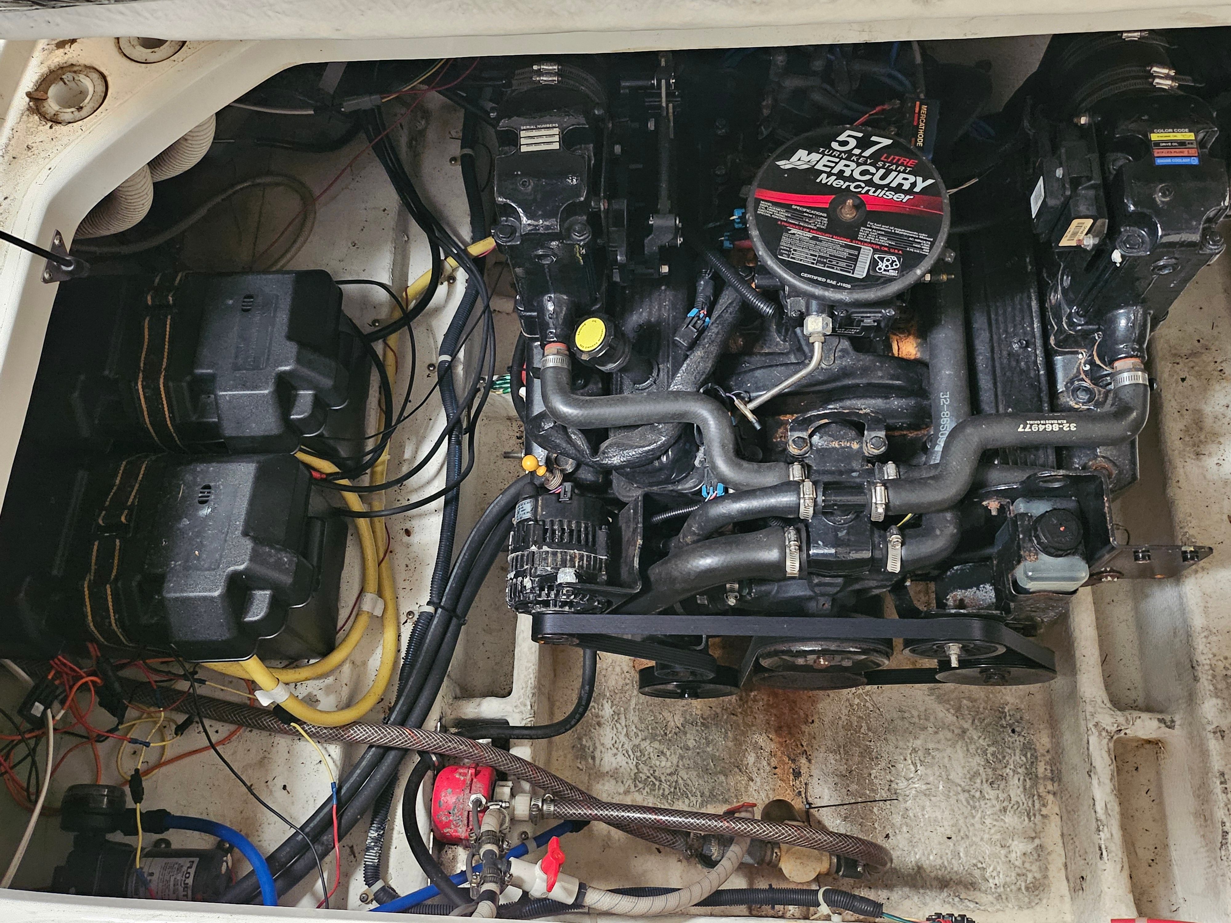 Engine compartment of a 2005 Bayliner 242 Ceara with a 5.7-liter Mercury engine.