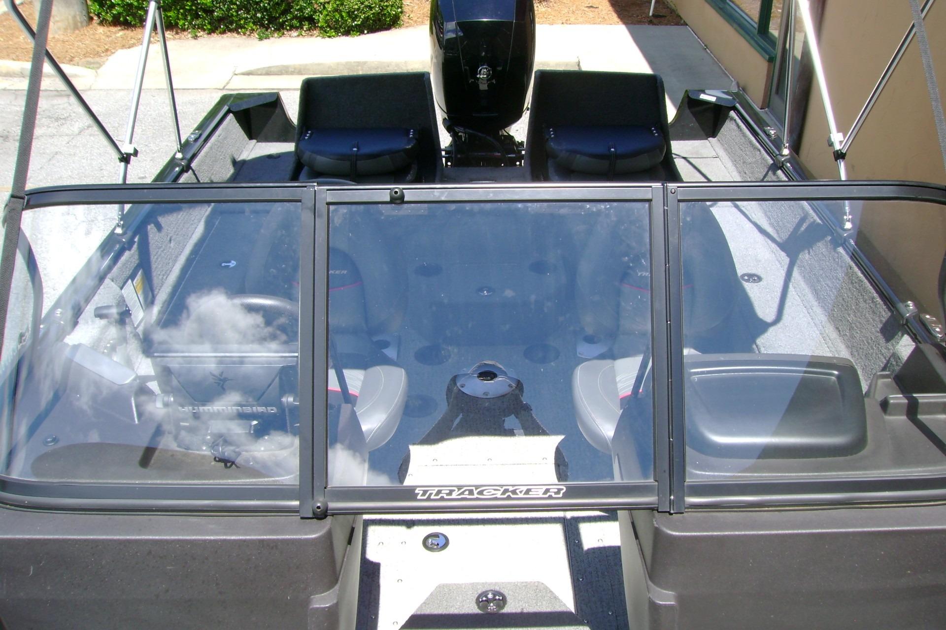 2023 Tracker Pro Guide V-175 WT boat interior with windshield and seating.