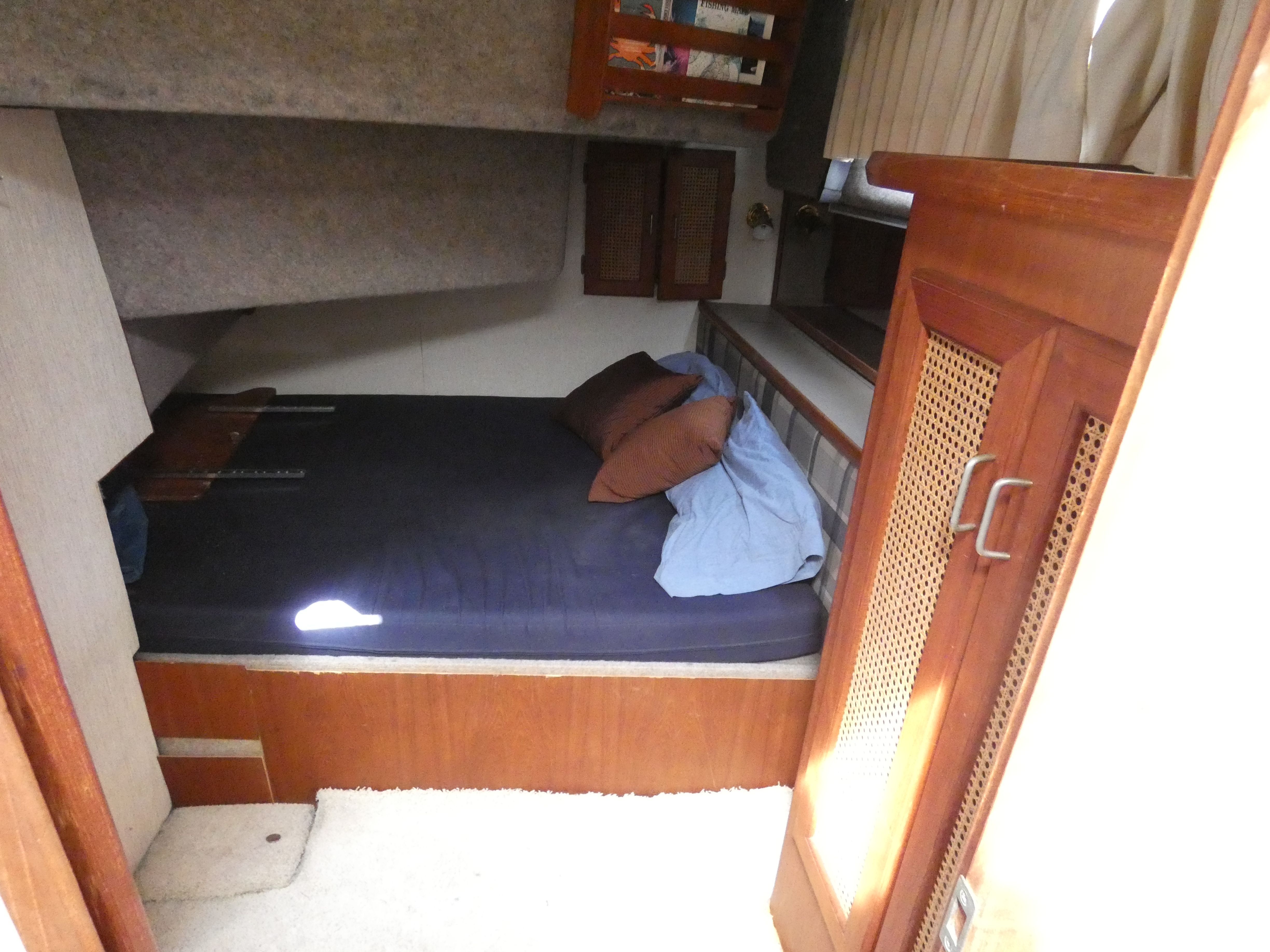 Interior of 1984 Bayliner 3870 Motoryacht featuring cozy sleeping area.