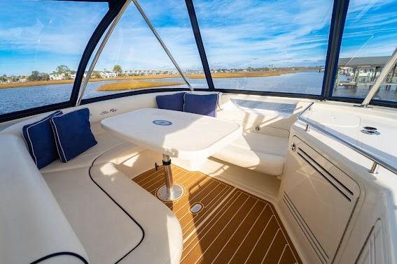 Luxurious 2006 Sea Ray 580 Sedan Bridge interior with elegant seating and scenic water views.